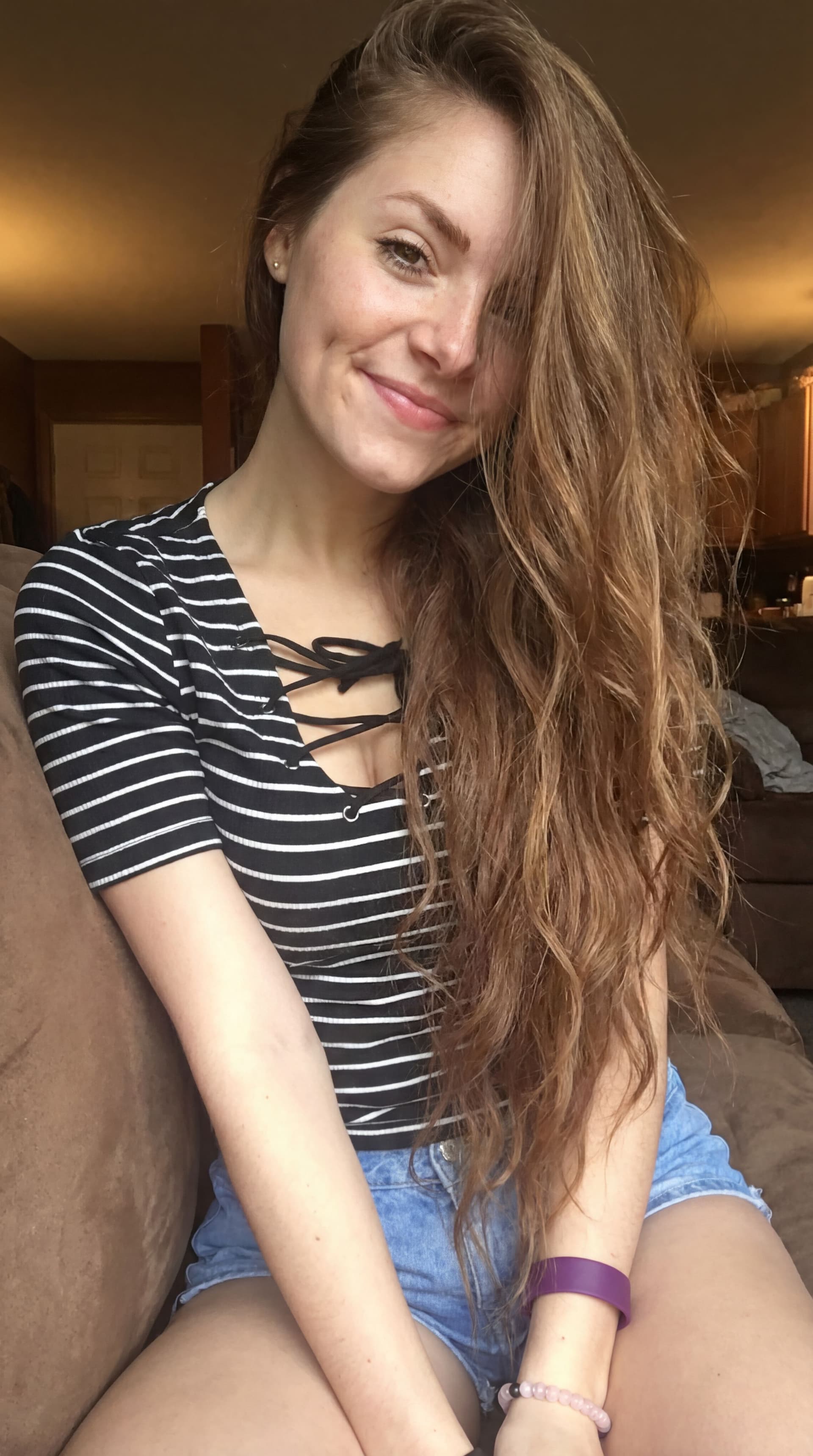 AI generated: Becky smiles shyly, leans forward causing her long hair to fall across her face. She tilts her head ...