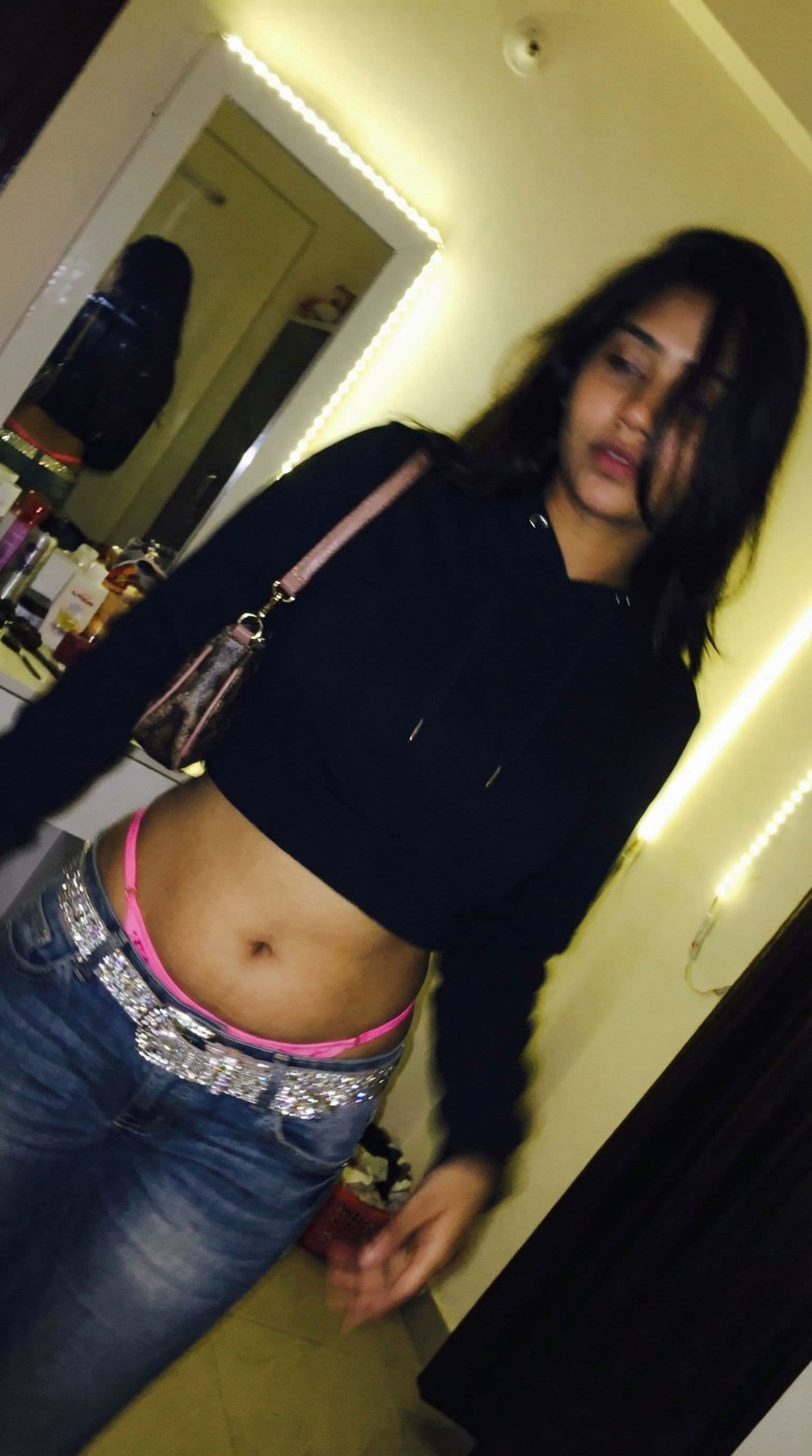 AI generated: a lo-fi 2015s-era, diagonally taken, low-quality iPhone photo of a 20-year-old baddie. The shot is i...