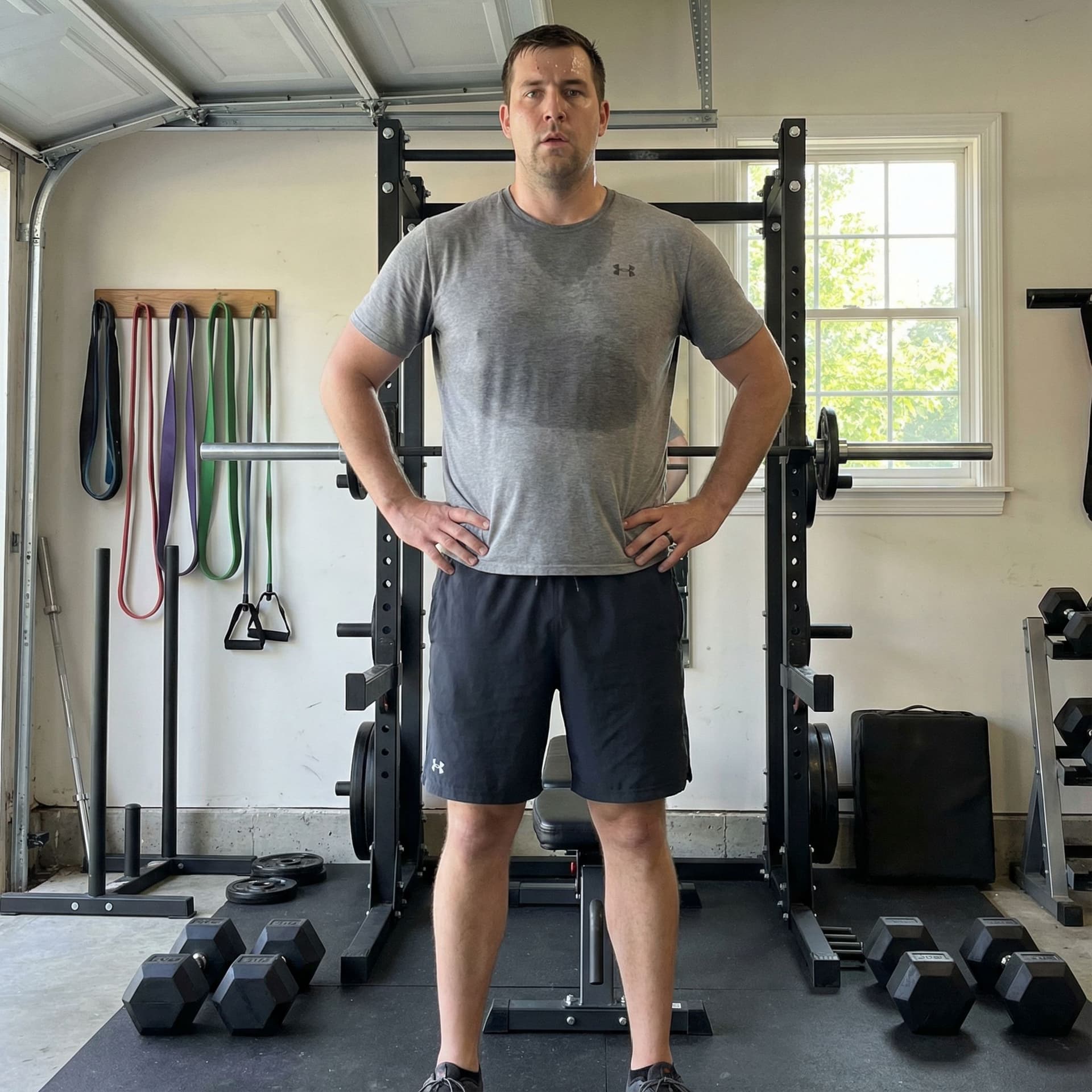 AI generated: Ultra-realistic full-body photo of a 6'6" 250 lb adult man in a home gym, athletic build with slight...