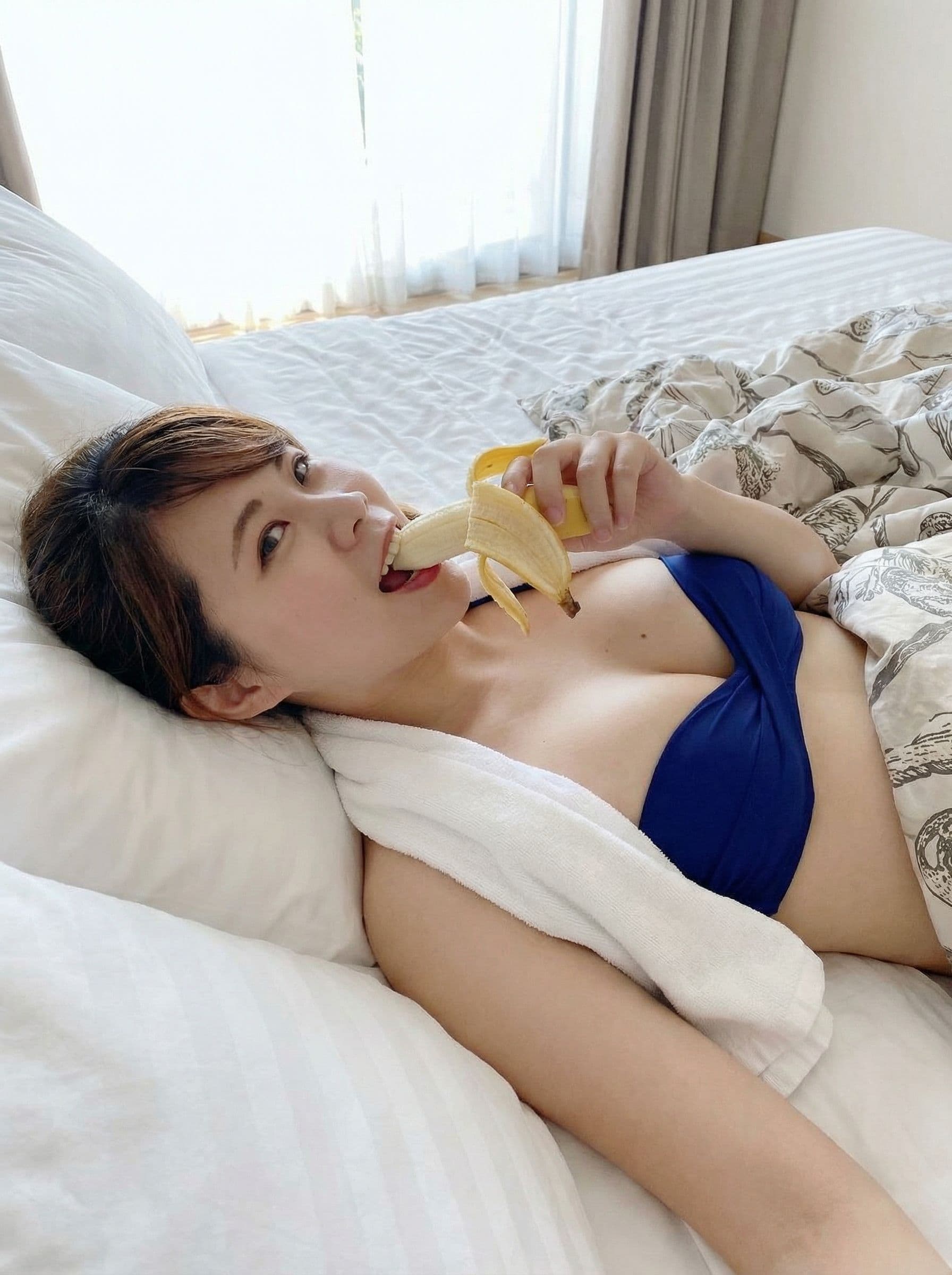 AI generated: A girl lay on the bad sucking a banana