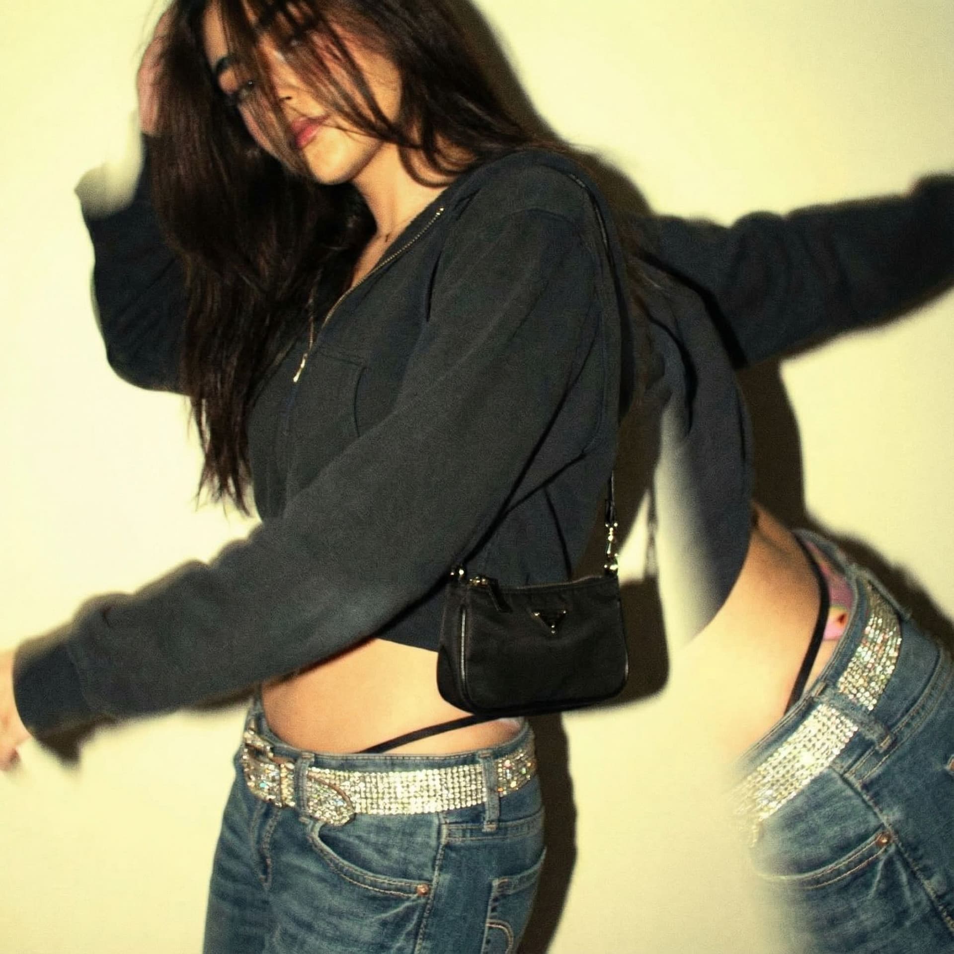 AI generated: a lo-fi 2010s-era, diagonally taken, low-quality iPhone photo of a 20-year-old baddie. The shot is i...
