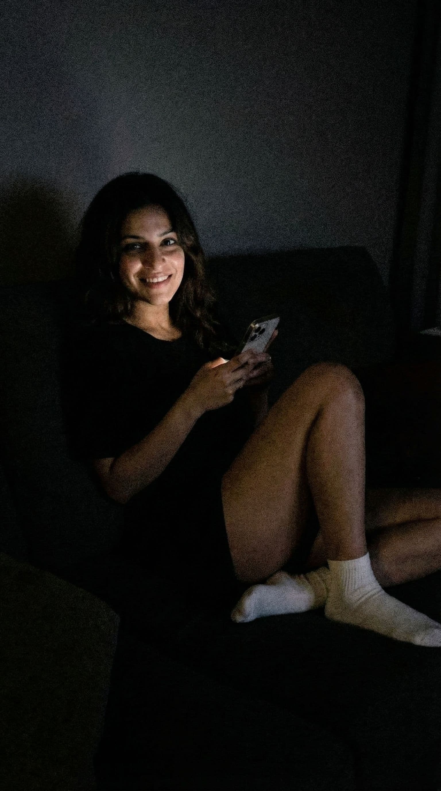 AI generated: Romantic selfie,a sloppy snapshot. on a couch at night(no lights), top and white socks 