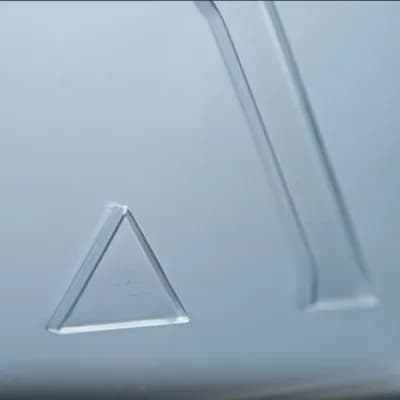 AI generated video: Make the glassy logo render disappear slowly, fading out until it fully disappears, leaving only the...