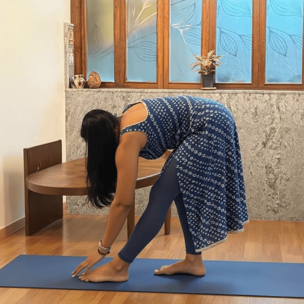 AI generated: full body back view of a girl doing yoga while stretching her legs, wearing sari and doing namaste w...
