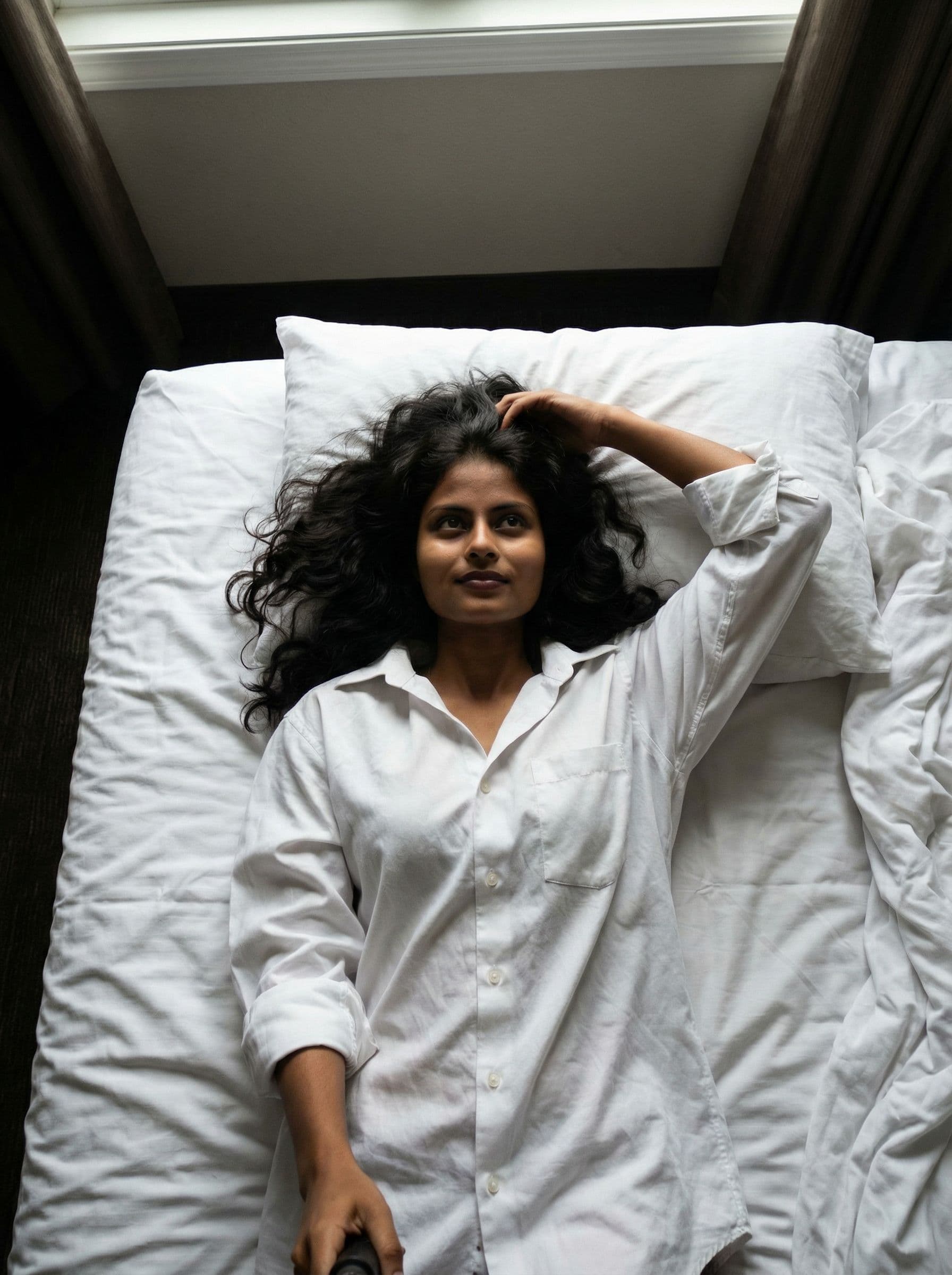 AI generated: .....Scene: Inside a modest motel room, on the bed amid rumpled white sheets. She lies back against ...