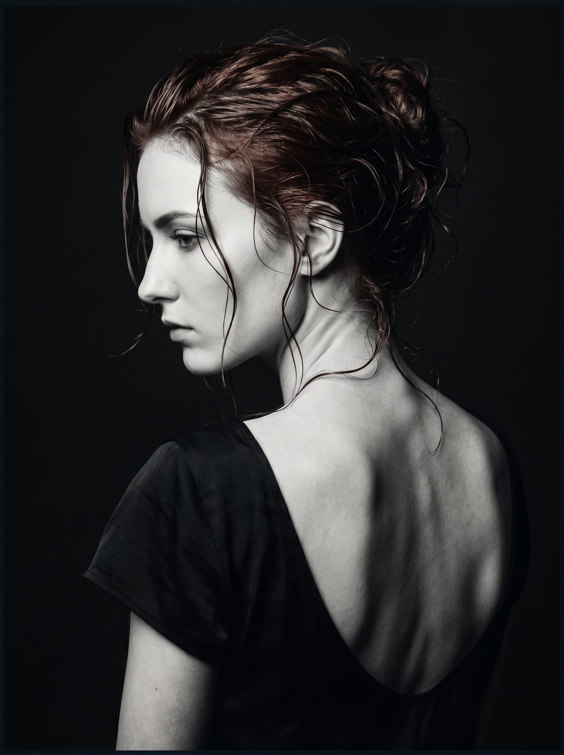 AI generated: (Nano Banana 2) A dramatic, low-key, high-fashion studio portrait of a young woman's profile and bar...