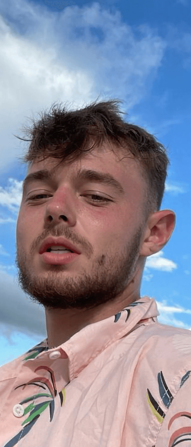 AI generated: Change facial expression so the guy licks his lips.