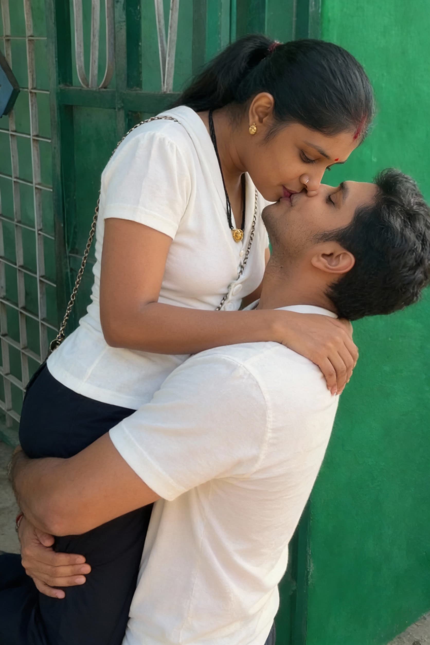 AI generated: The man lifting the women on his arms and kissing the lips
