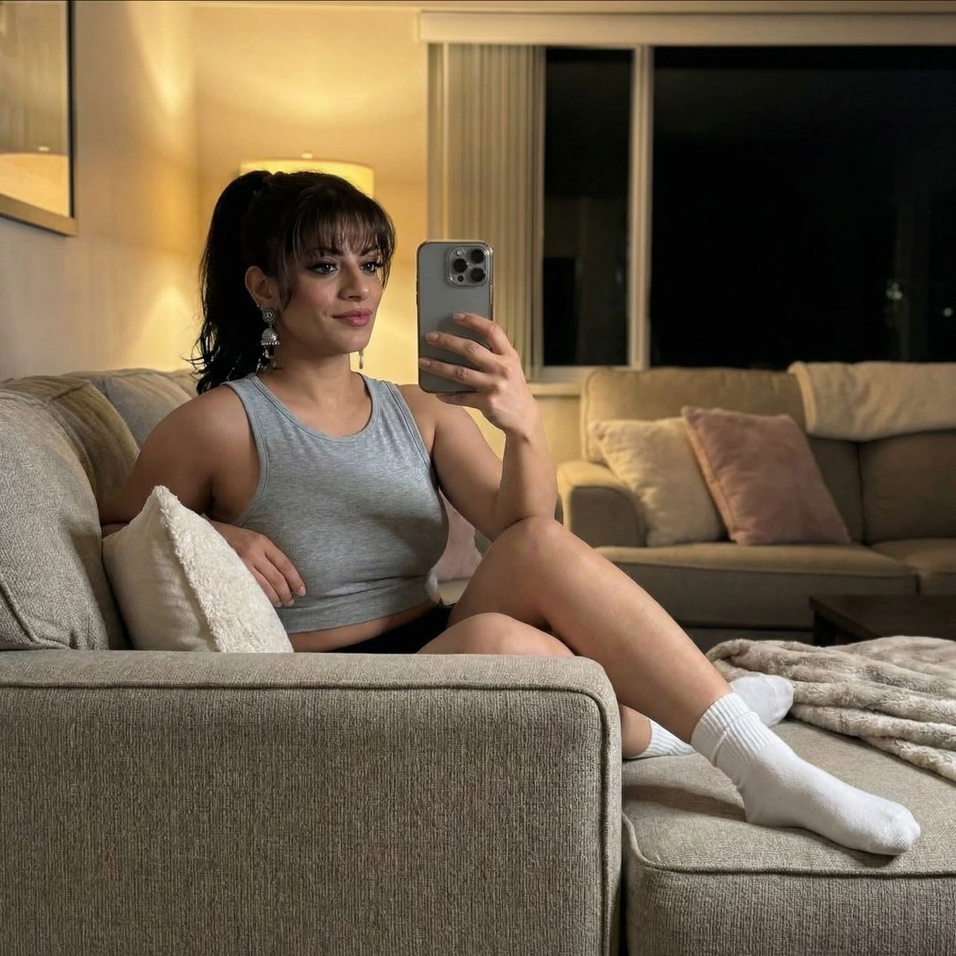 AI generated: Taking a selfie on a couch at night, wearing a cropped home tanktop and white socks, dont alter orig...