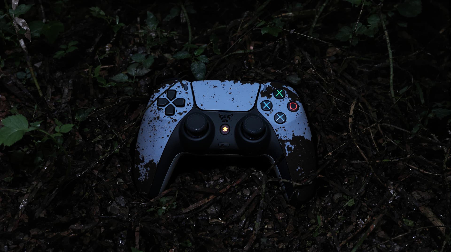 AI generated: A realistic image of a PlayStation 5 controller abandoned in a dense forest at night, partially buri...