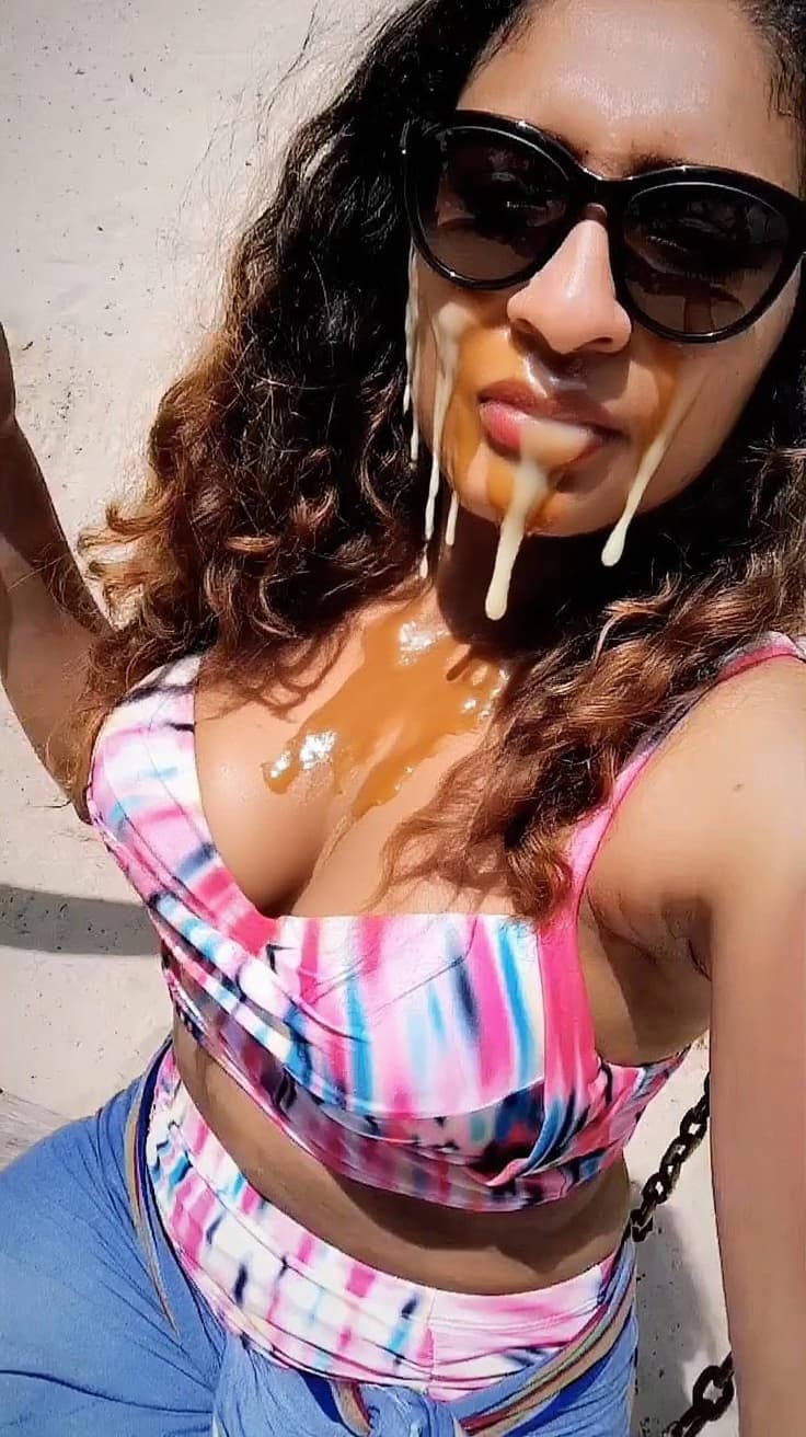 AI generated: her breasts are exposed. her face and breasts are drenched in cum