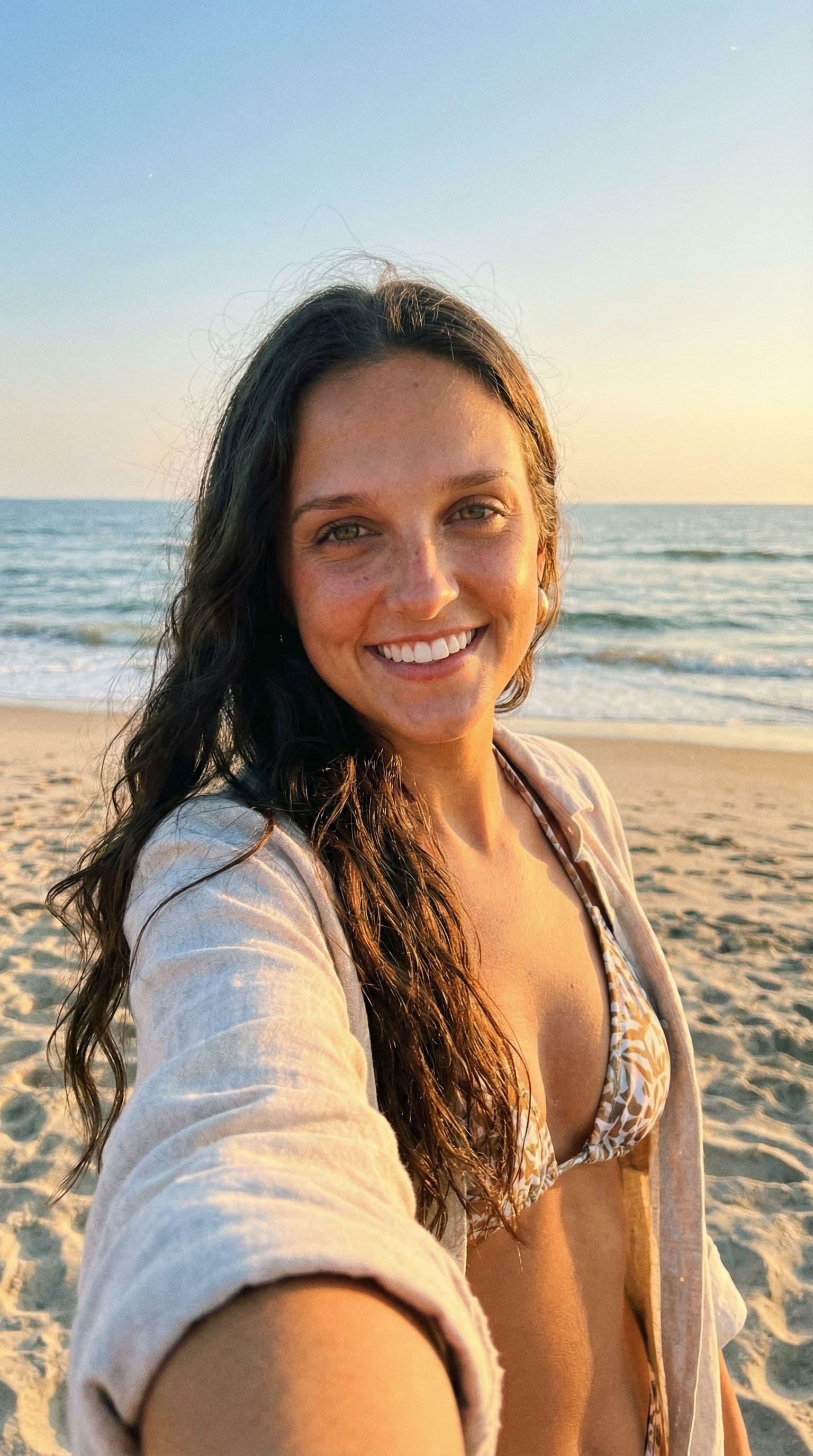 AI generated: Hyperrealistic photo, beautiful girl model in beachwear, shot on iphone 14 pro max, long dark hair, ...