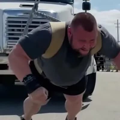 AI generated video: A man pulling a truck