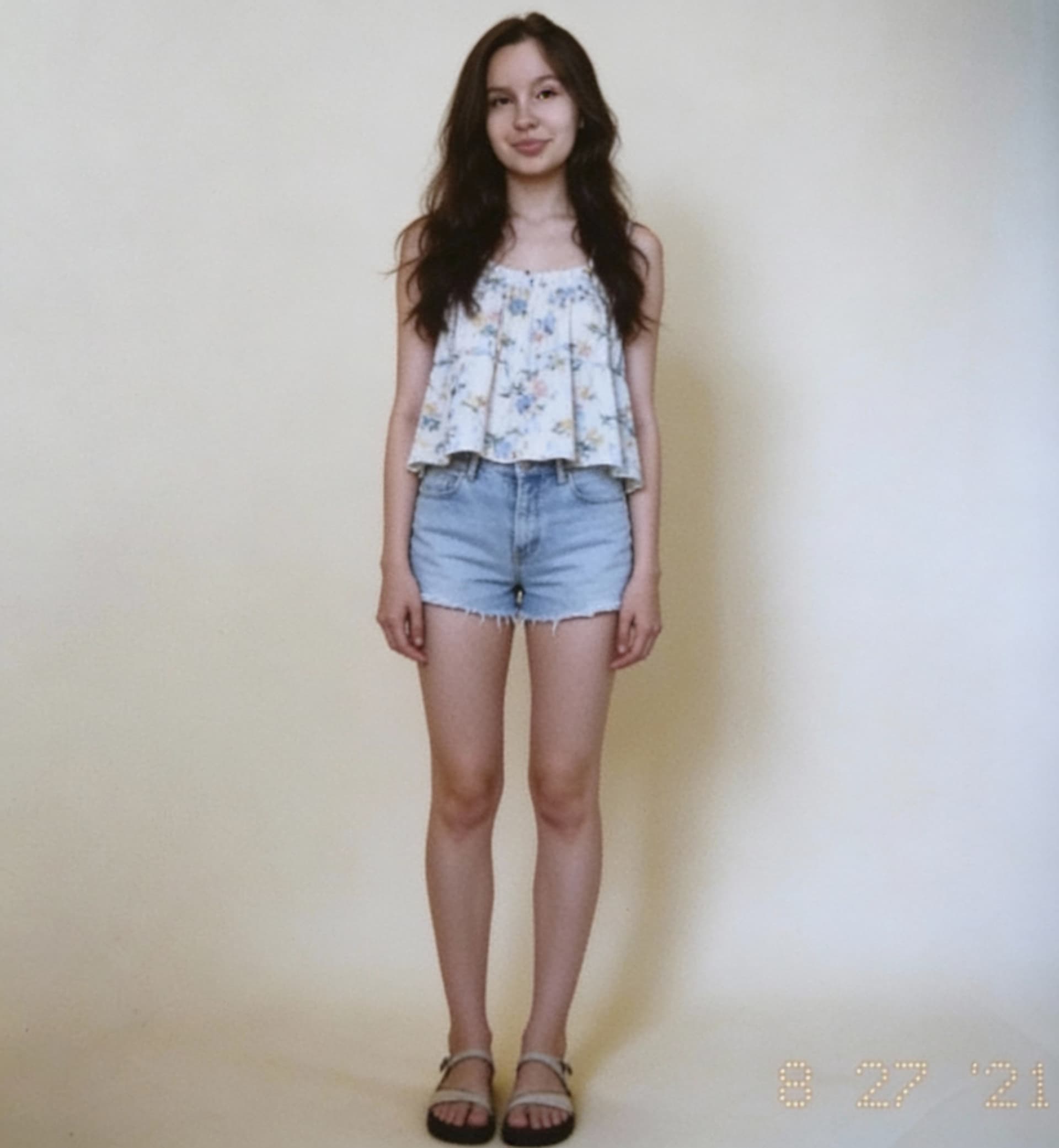 AI generated: Create a full-body, front-facing image of her. Summer clothes