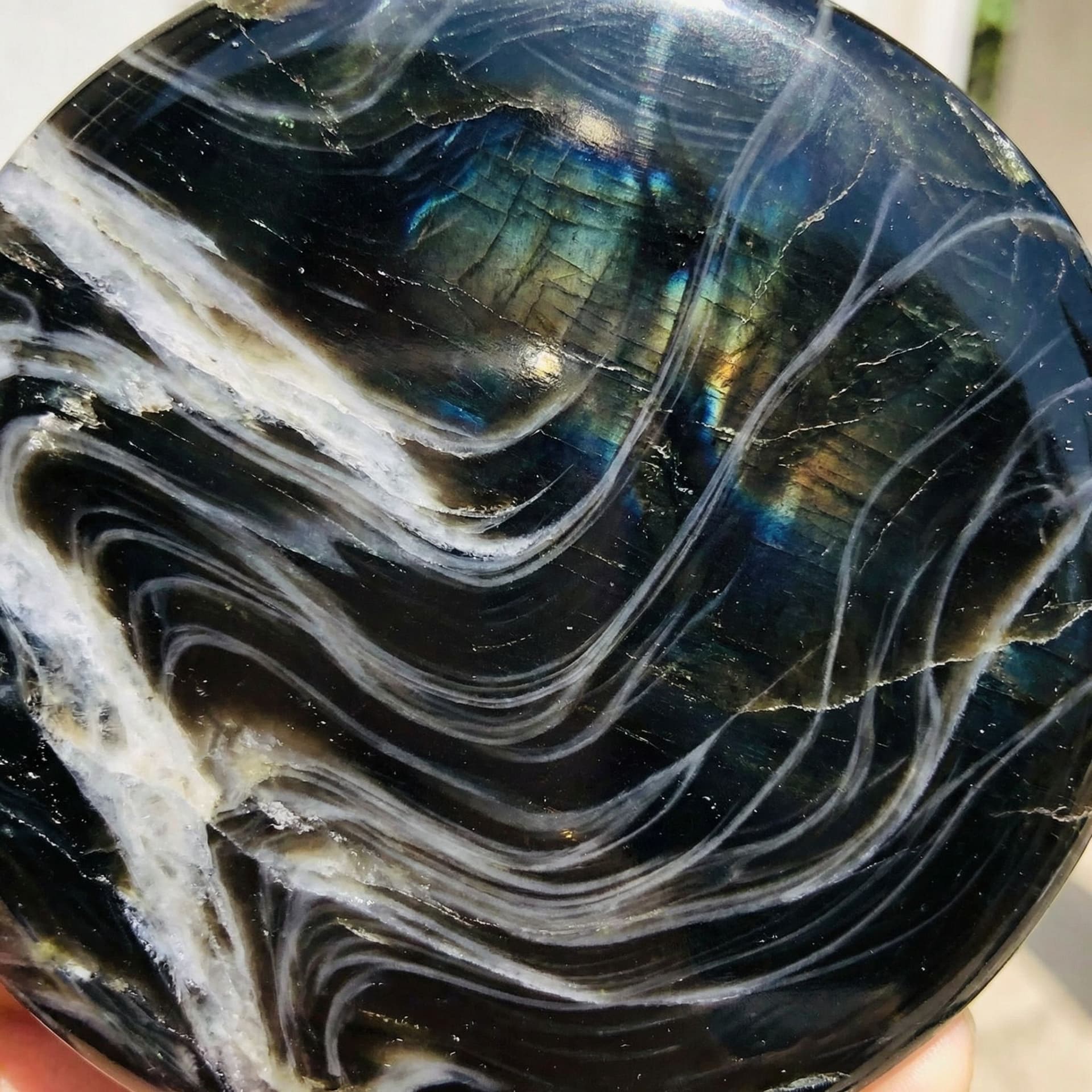 AI generated: Black obsidian with white veins flowing through it like wind and grey whips also flowing through it ...