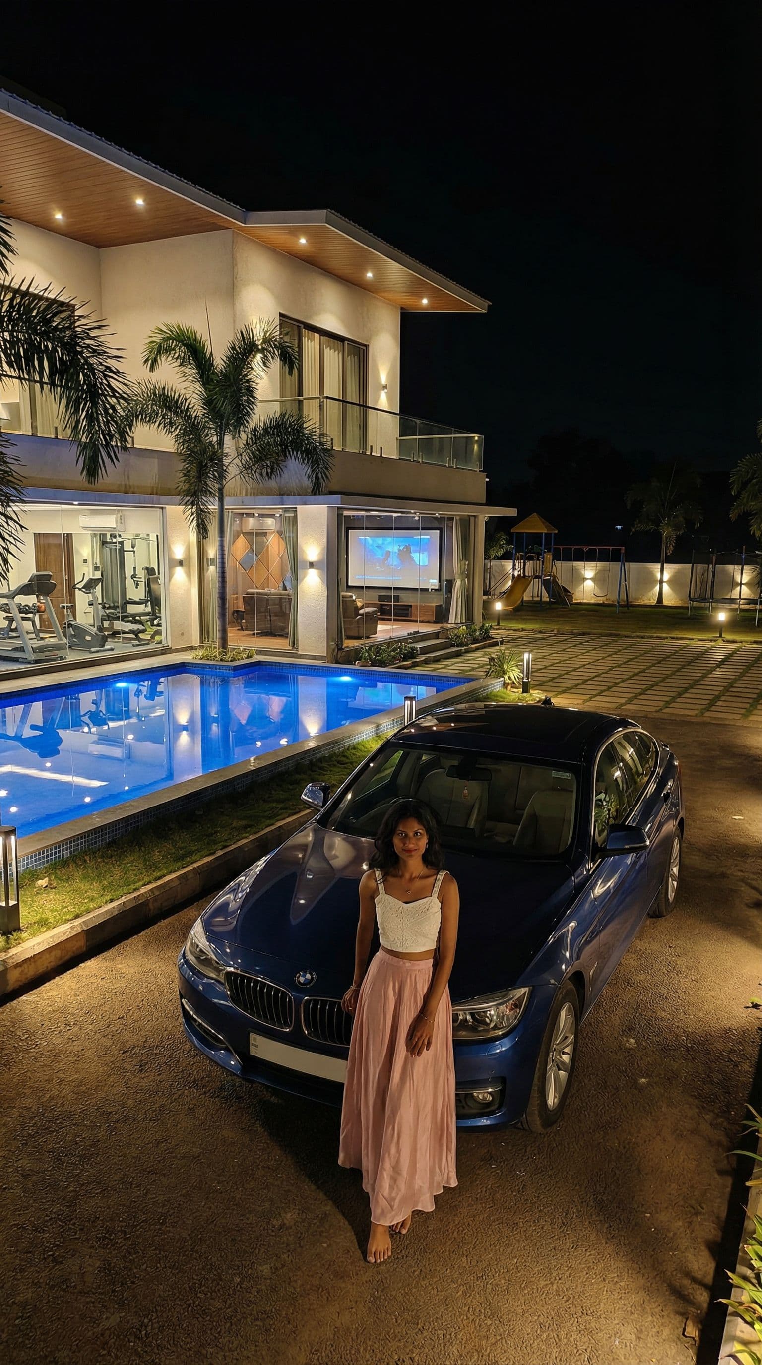 AI generated: 

> Night view of a modern duplex dream home with glowing swimming pool, glass-wall gym, private the...