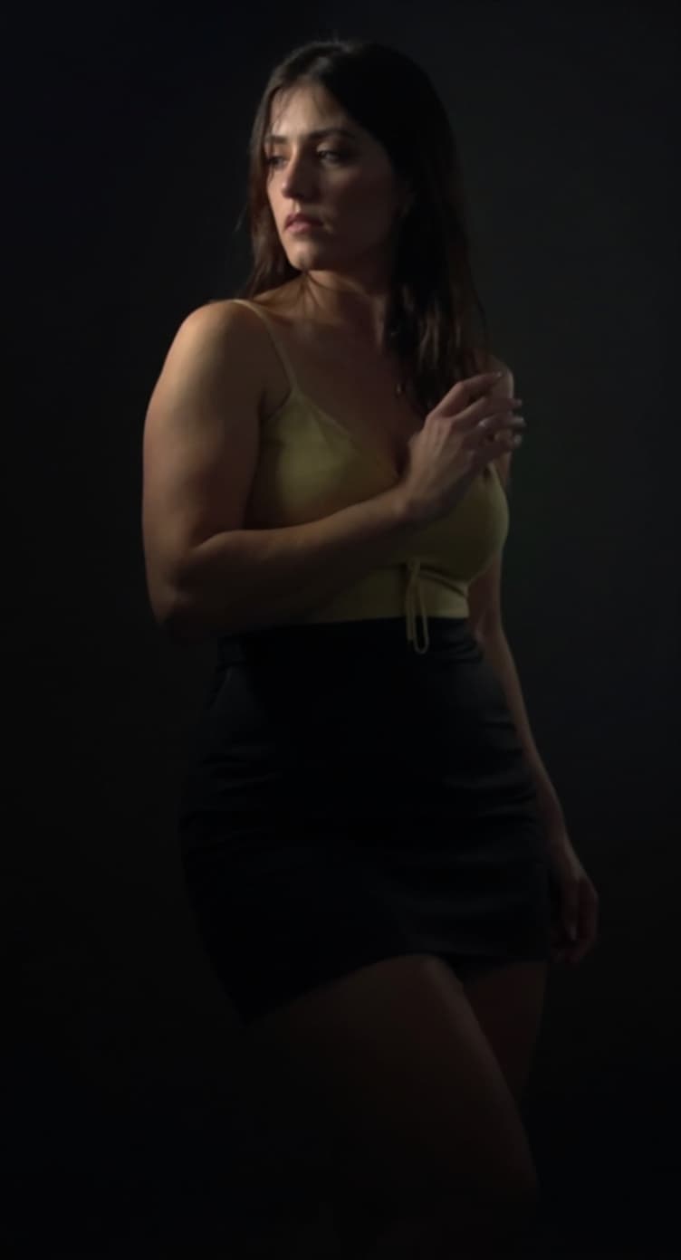 AI generated: Her large breasts almost spill out of her revealing top