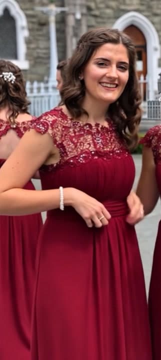 AI generated video: The woman quickly pulls her dress off. Underneath she is only wearing a small, thin, white lace bra ...