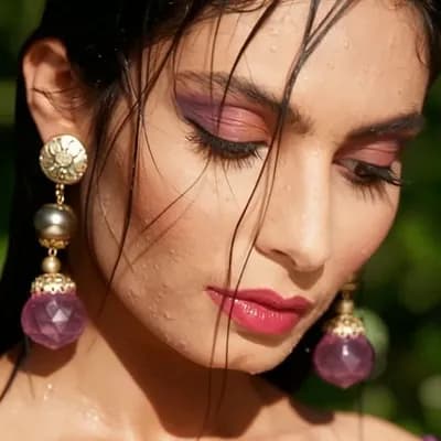 AI generated video: Beautiful model with a sultry look, her eyes look down, then looks up directly at camera as she blin...