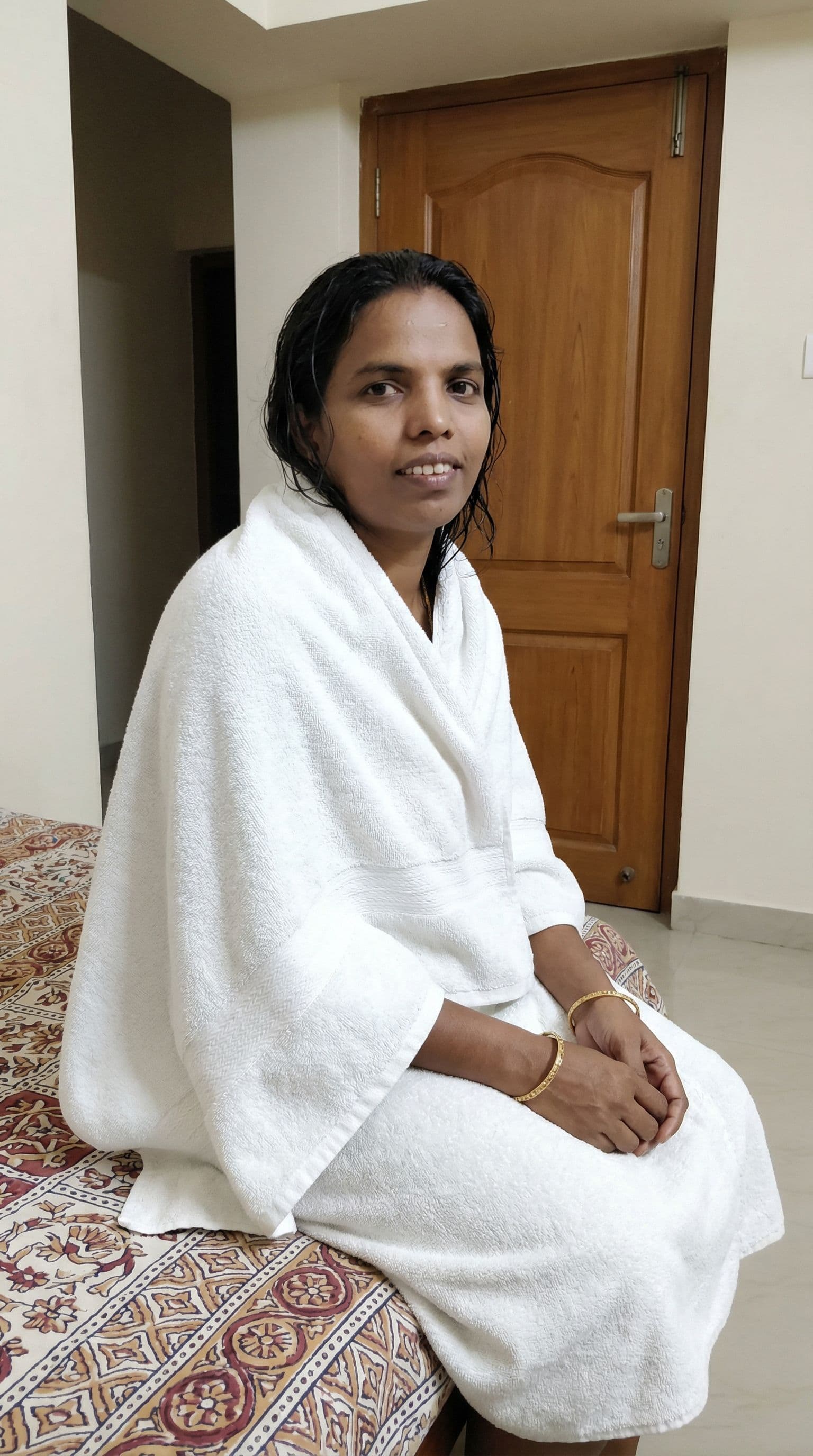 AI generated: Remove saree show bath in towel and close the door sitting in the bed 