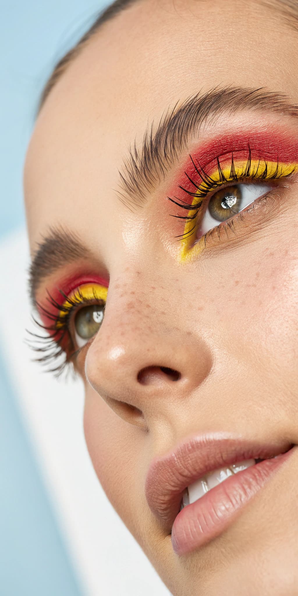 AI generated: A woman's eye is shown with the focus on her eyelashes, which appear to be lengthened with bright ye...