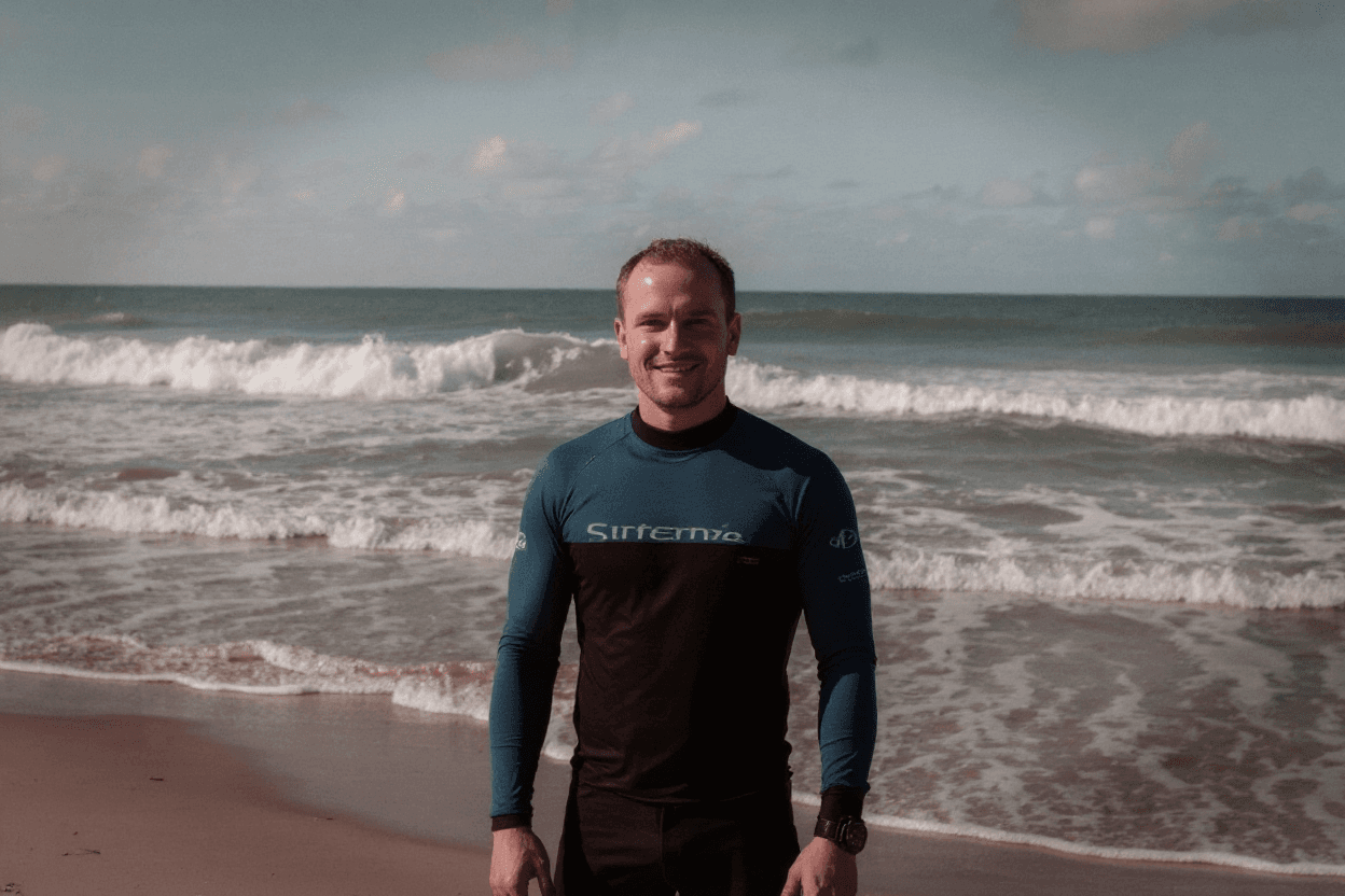 AI generated: Surf school owner in front of his surf school.
!important: No surfboards, no texts