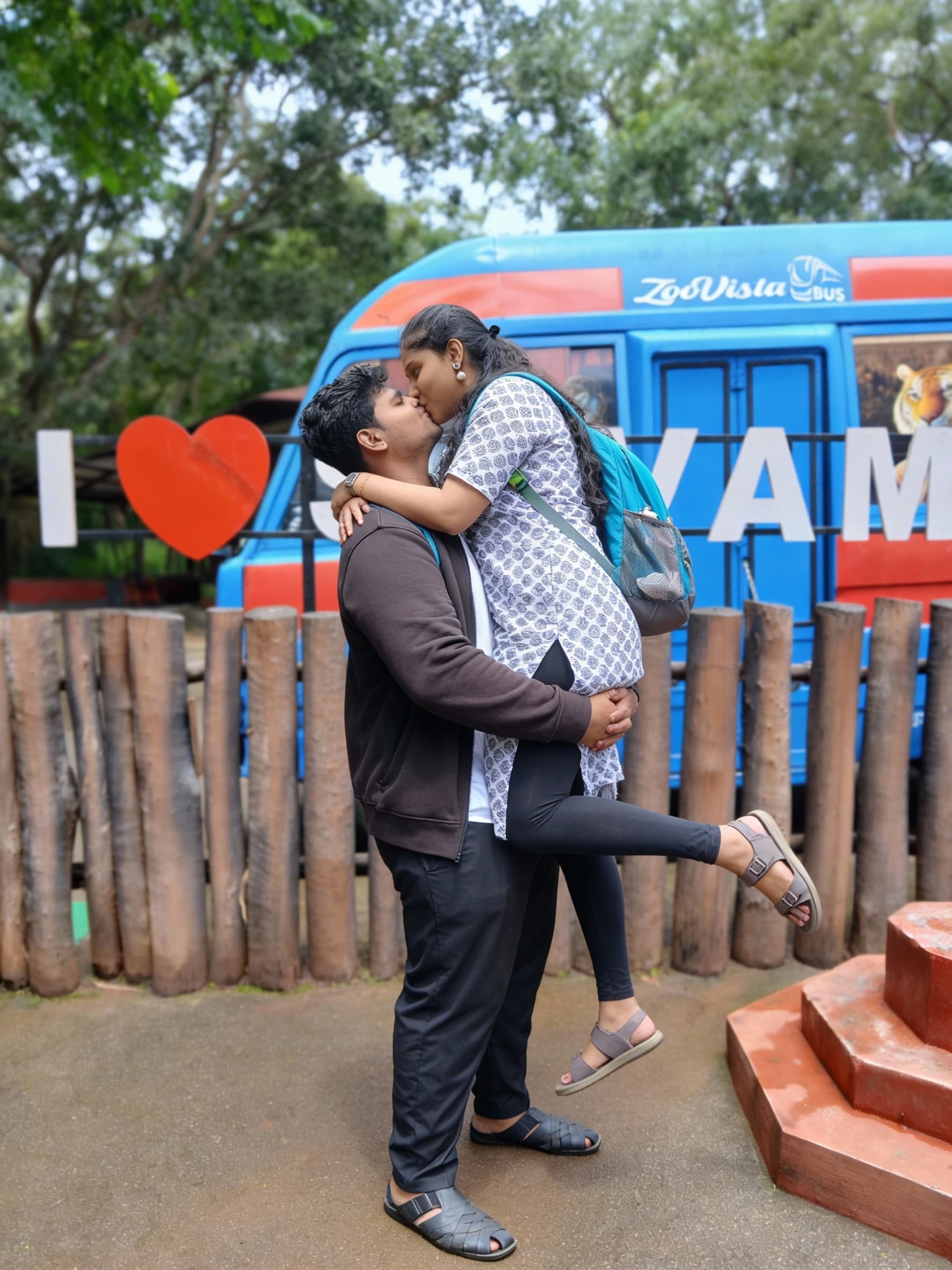 AI generated: The lifting the women on his arms and kissing the women lips 