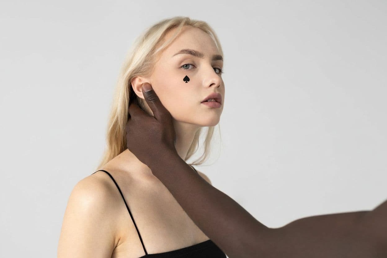 AI generated: Make a little black spade tattoo under the eye
