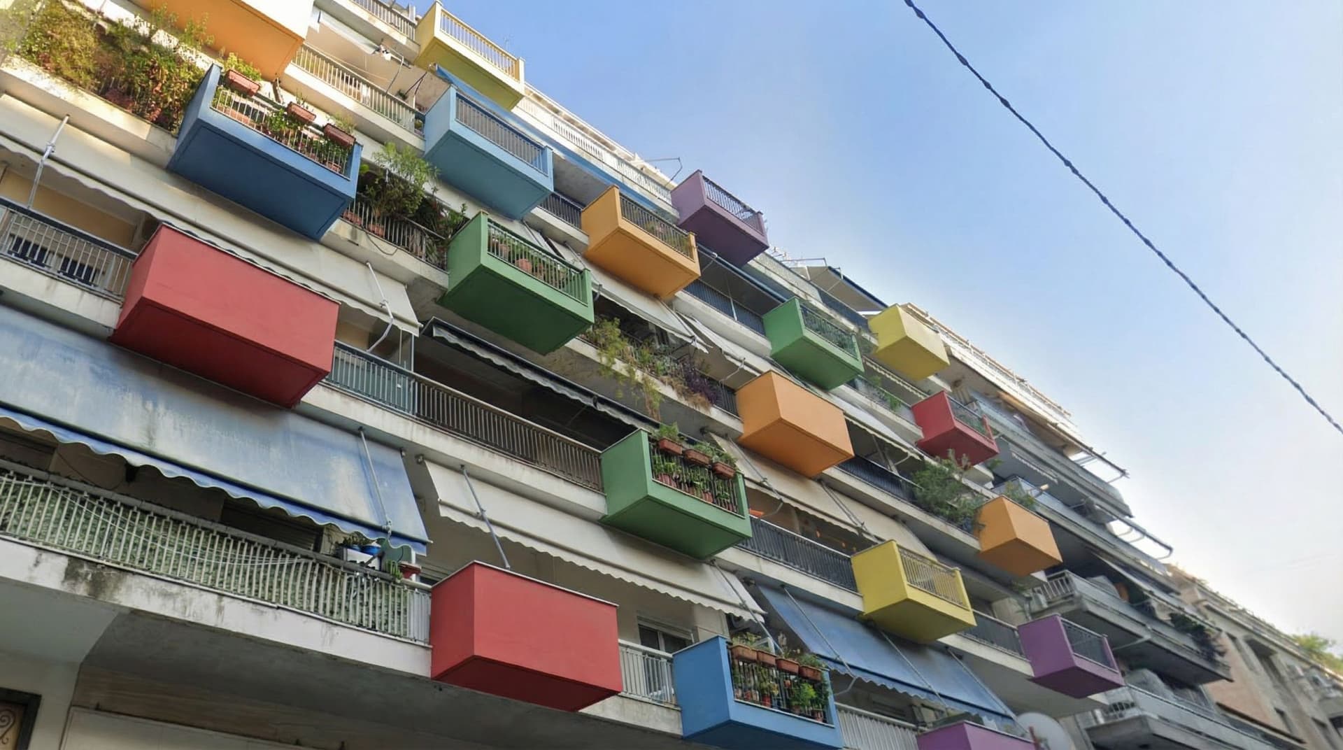 AI generated: Add colourful boxes of various sizes and colours that hang out of the facade of this building that c...