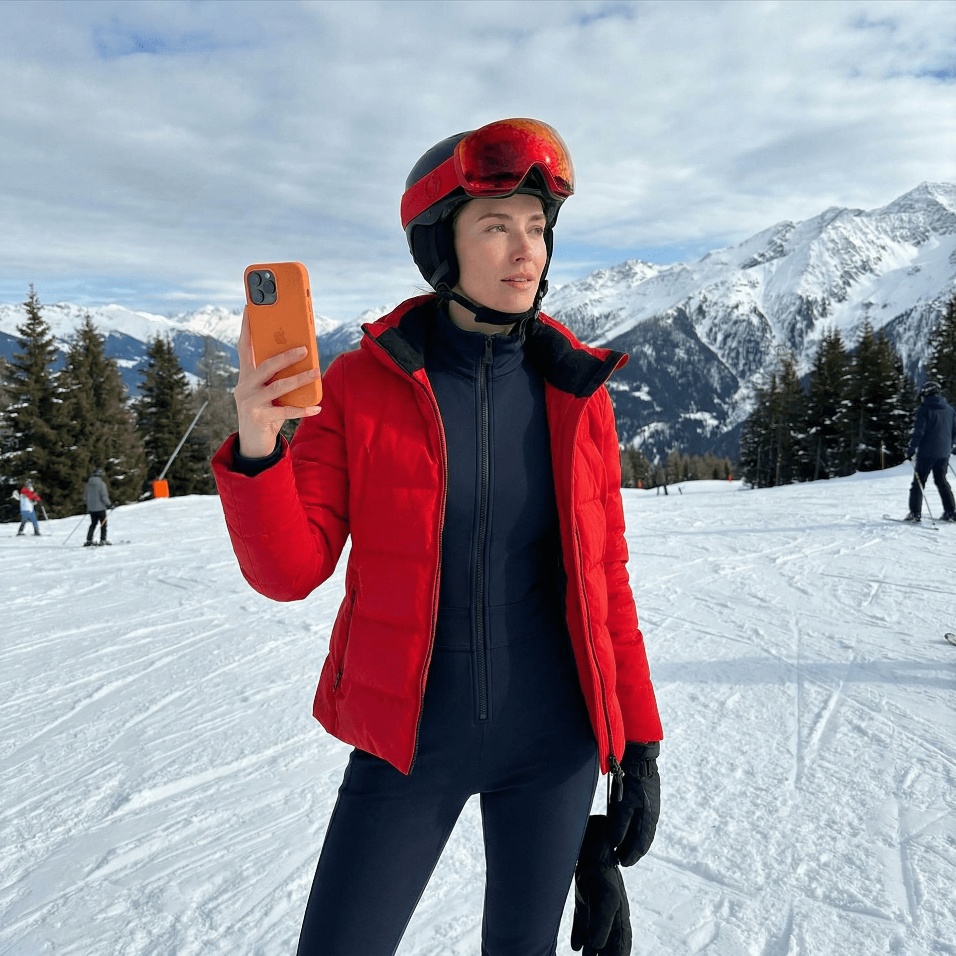 AI generated: skinny girl with red ski gogglesd and on the ski slope and snow with a fitted outfit and a red jacke...