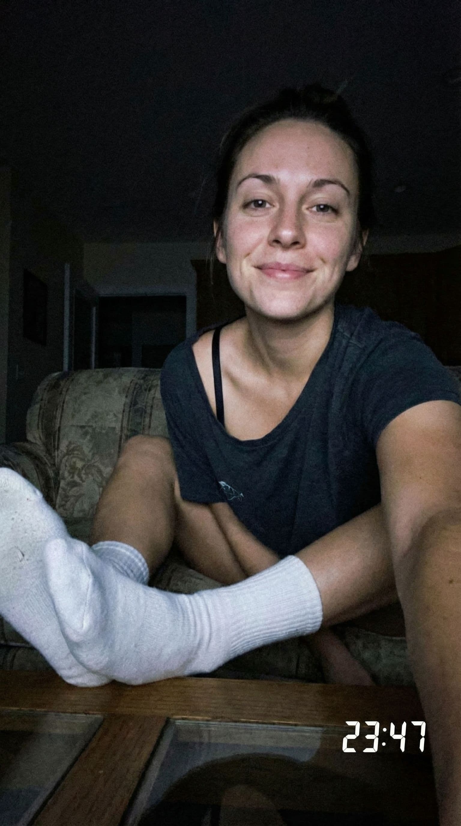 AI generated: Seductive expression, selfie looking at me,a sloppy snapshot. Sitting on a couch at night teasing(no...