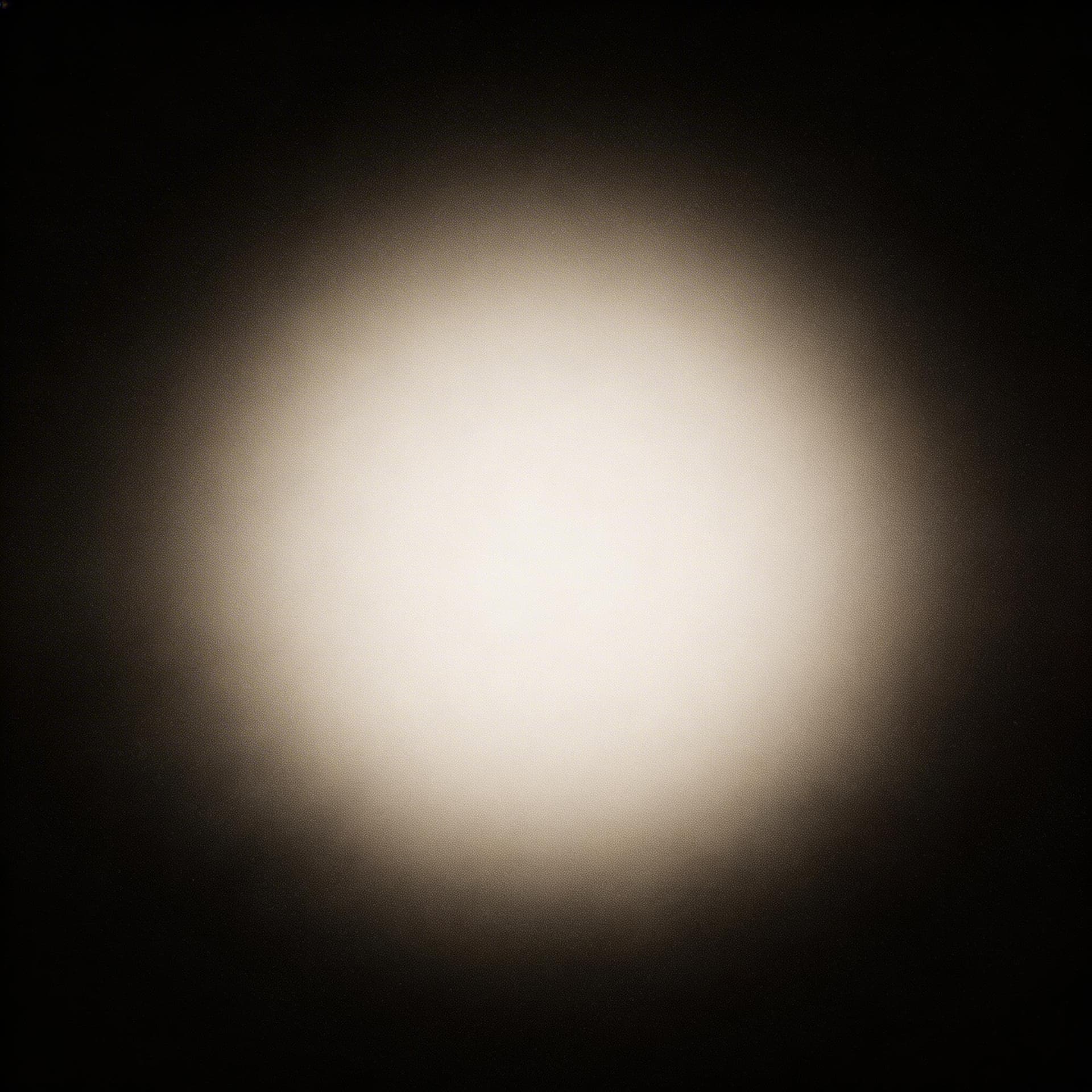 AI generated: dark minimal background, soft center glow fading into deep black edges, cinematic lighting, subtle t...