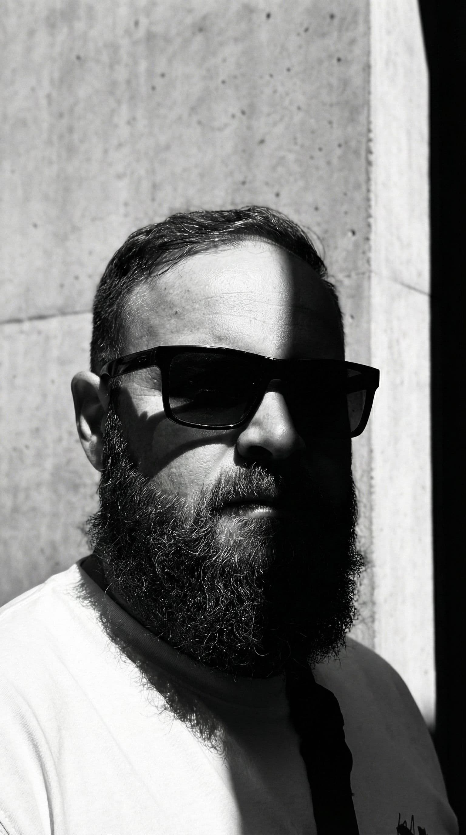 AI generated: a black and white photo of a man with shadow., in the style of minimalist beauty, light bronze and b...