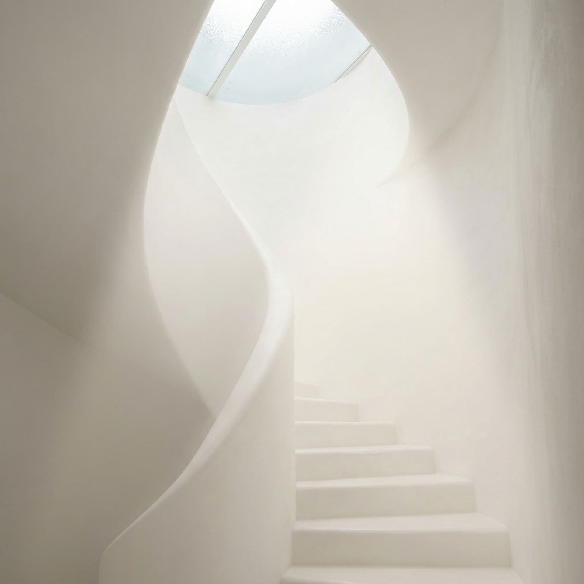 AI generated: A white stairwell rises into near-abstraction, flooded from above by a skylight that pours down a th...