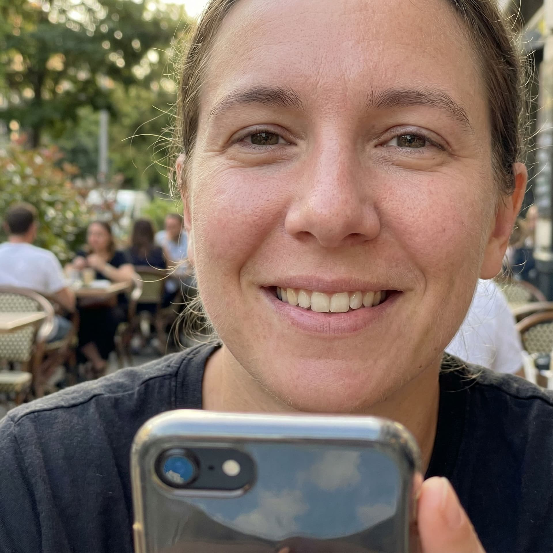 AI generated: A realistic iPhone selfie photo, captured with natural daylight, sharp foreground and slightly blurr...