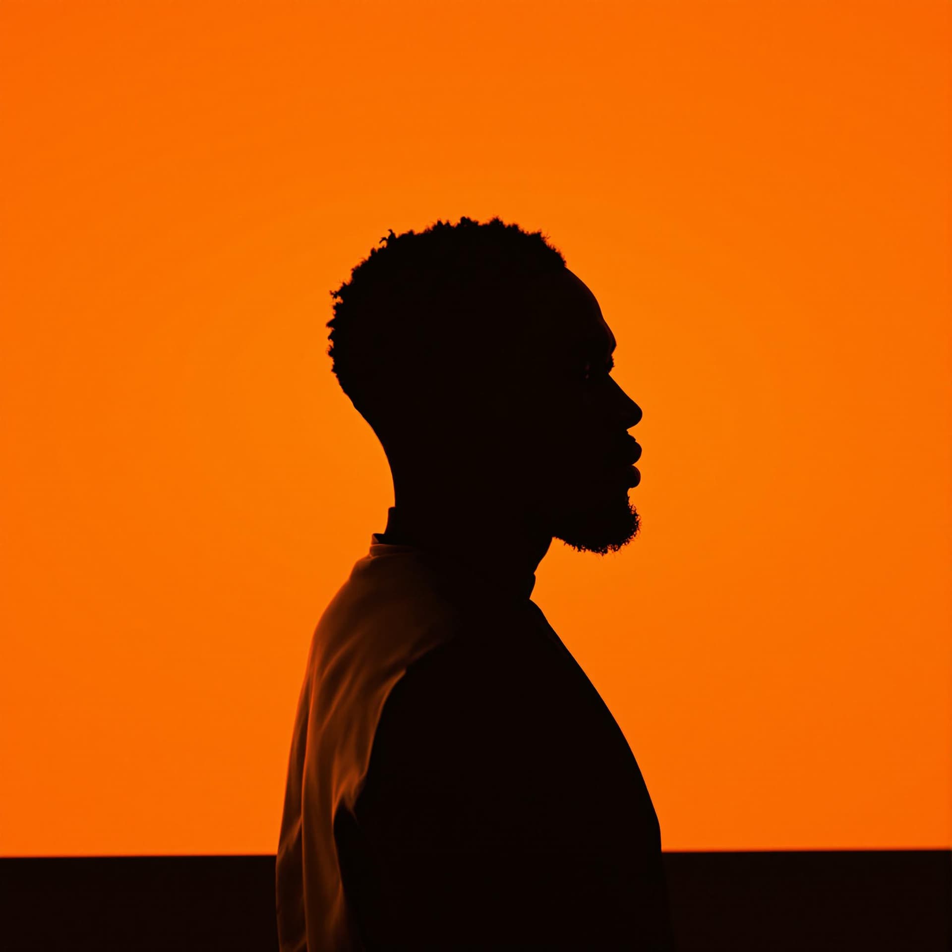 AI generated: photography, portrait of contrast, profile silhouette of a black man, vibrant orange backdrop, visua...