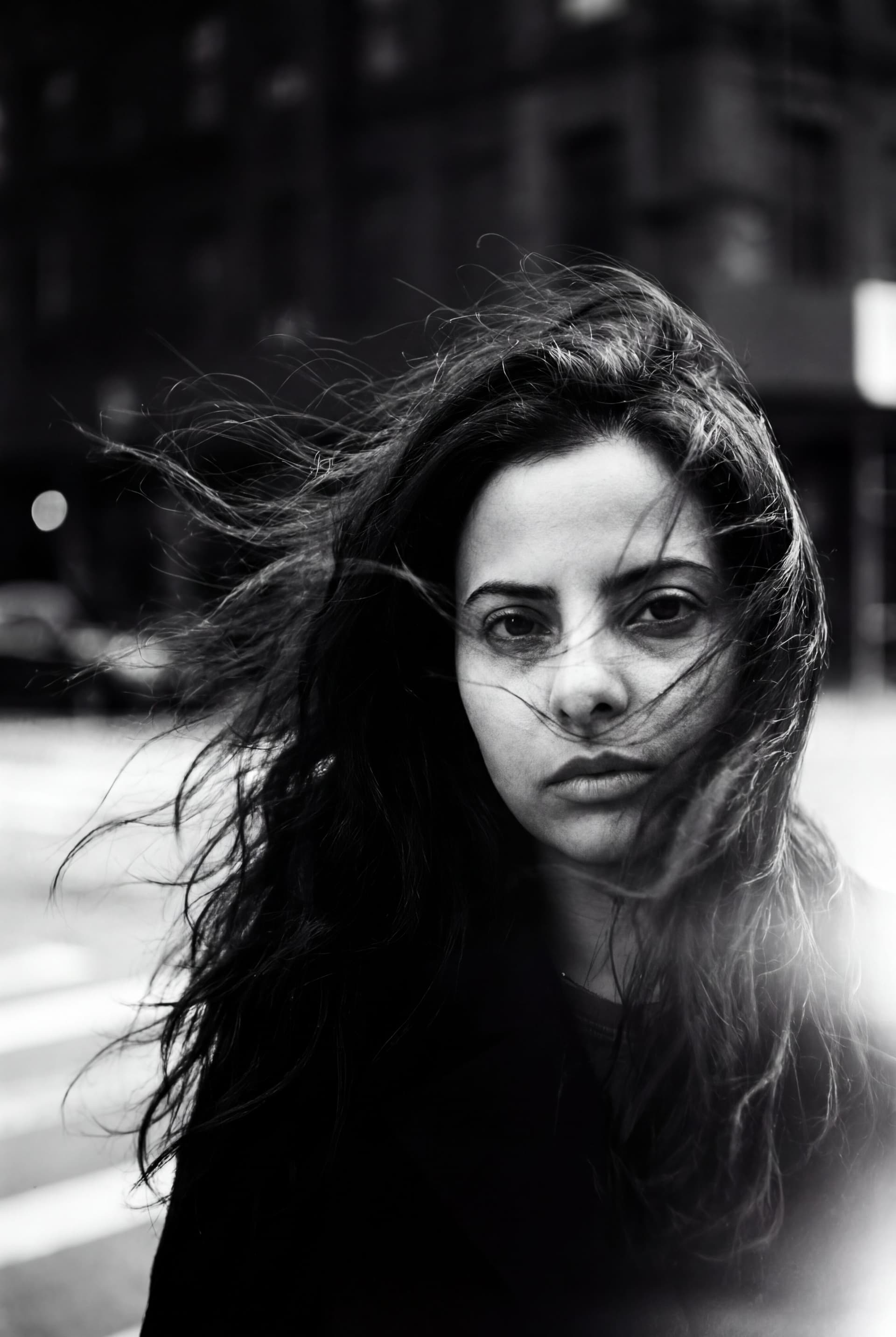 AI generated: a woman with long wild hair on a windy day, in the style of toy camera effects, haunting elegance, f...