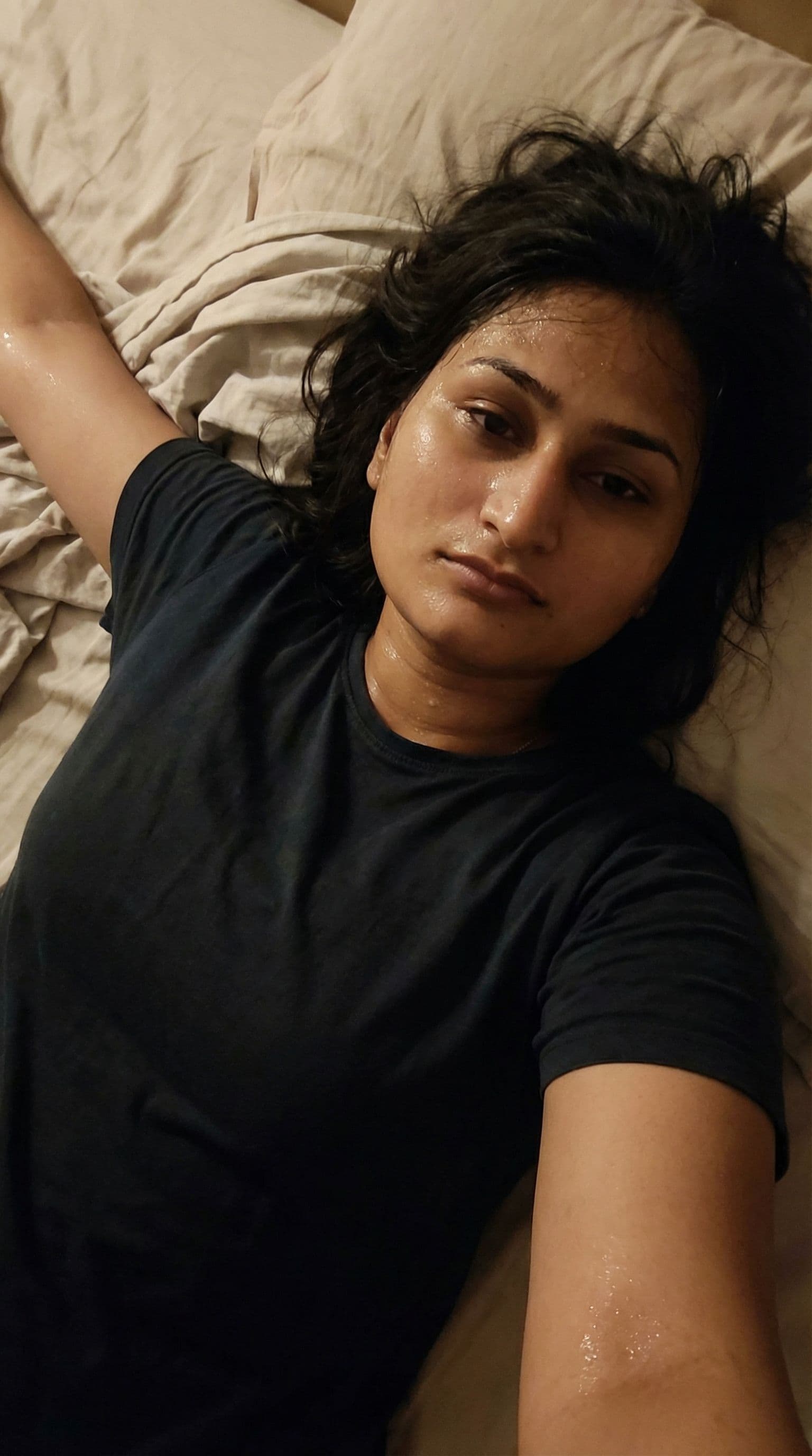 AI generated: The girl is lying completely naked on the bed with her arms spread out on both sides. The girl's hai...