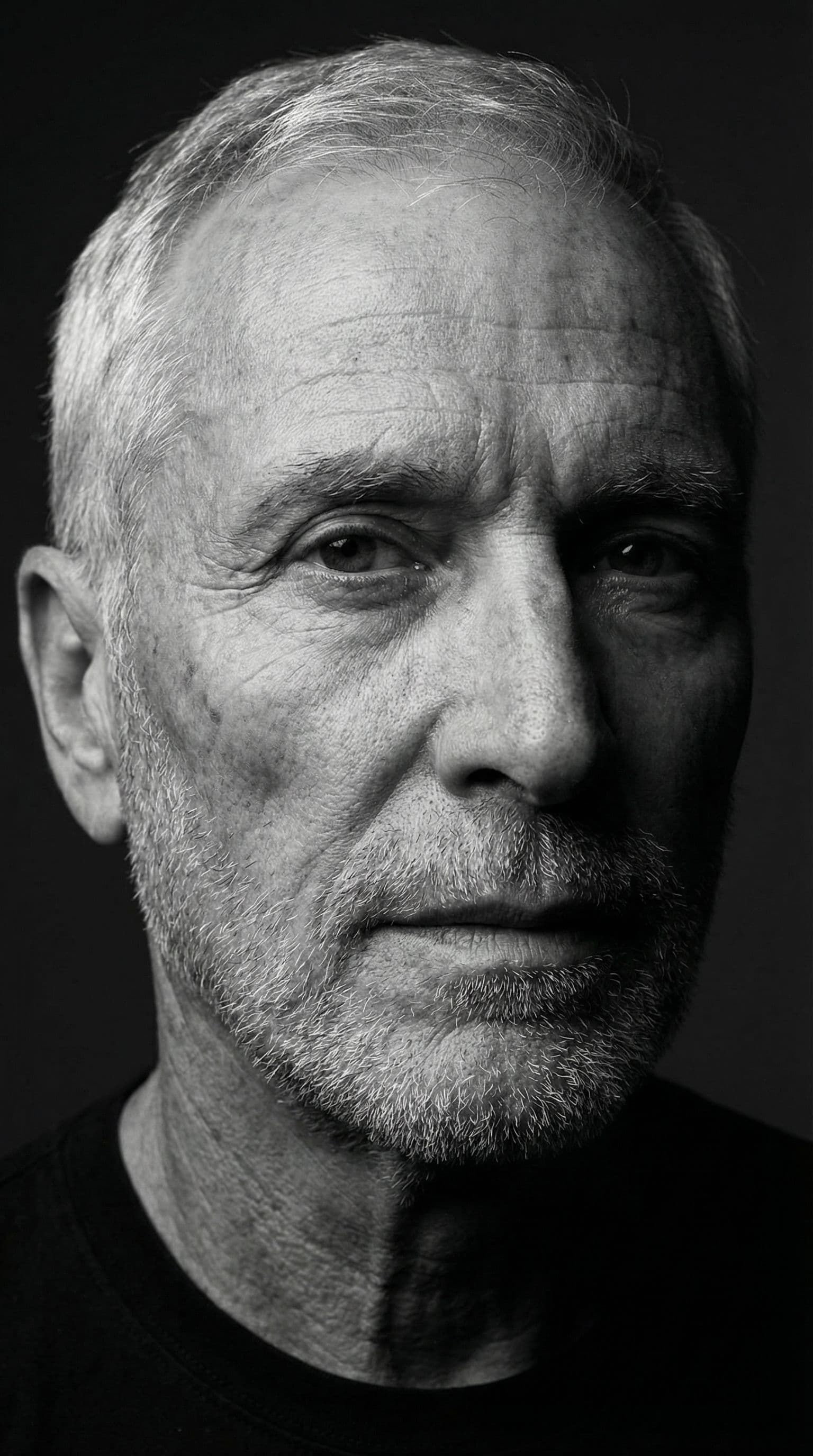AI generated: High-definition black and white portrait of an attractive mature man, 60–80 years old. Minimalist be...
