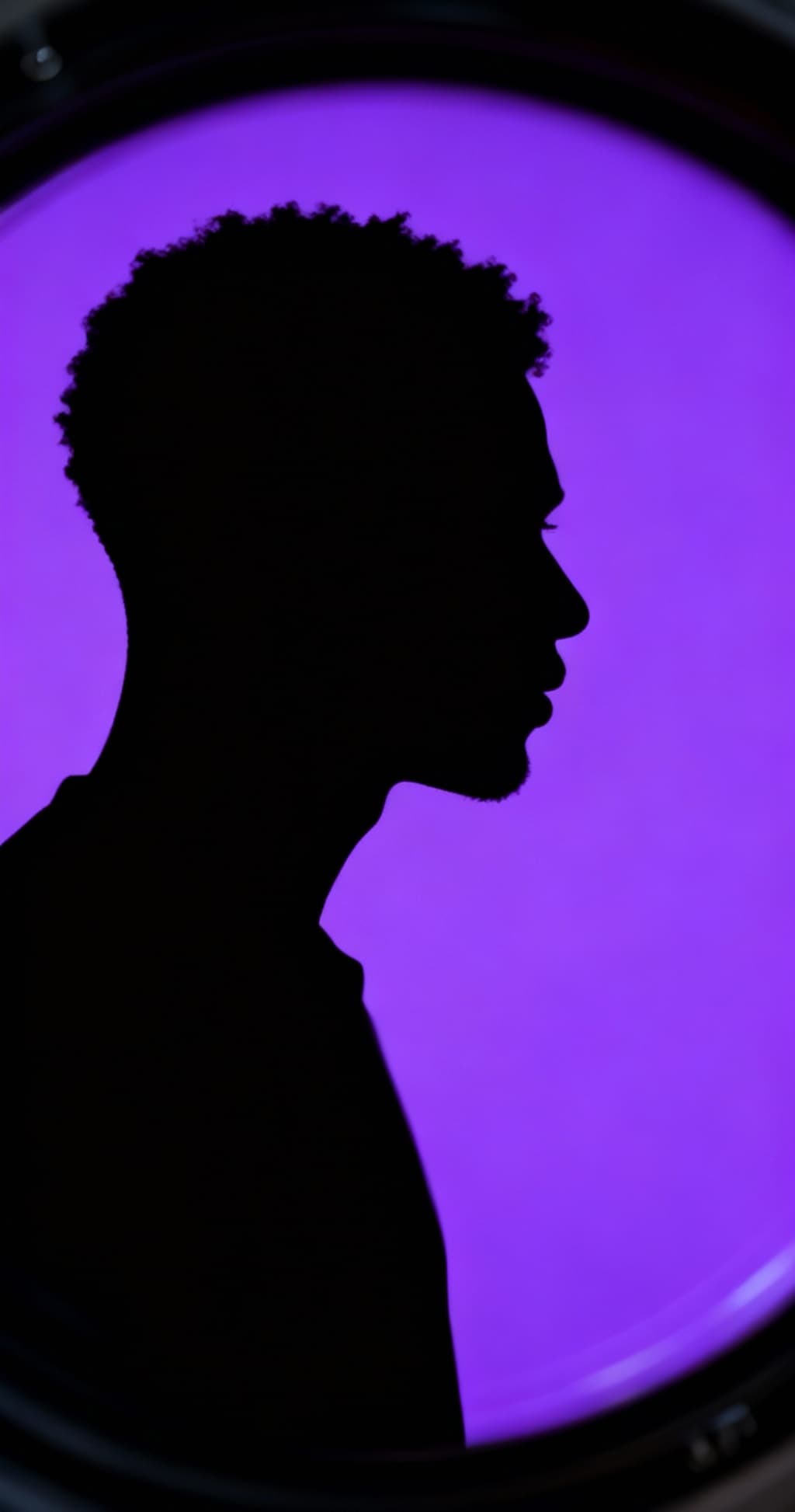 AI generated: photography, portrait of contrast, profile silhouette of a black man, vibrant purple backdrop, visua...