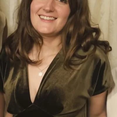 AI generated video: The woman opens the neckline of her dress wider and pulls the neckline down to her waist to show her...