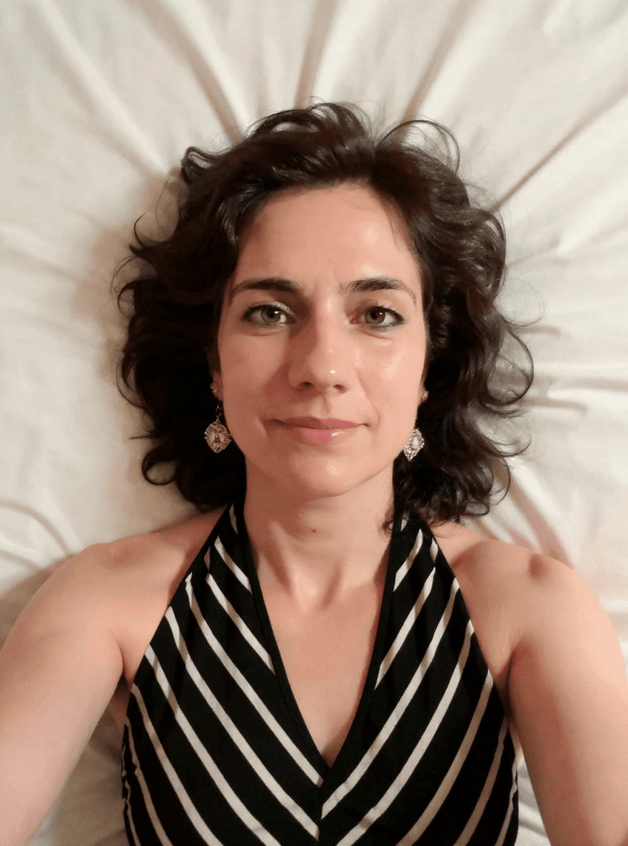 AI generated:  Me with blue eyes lying face down on the bed, in the style of animated gifs, light white and light ...