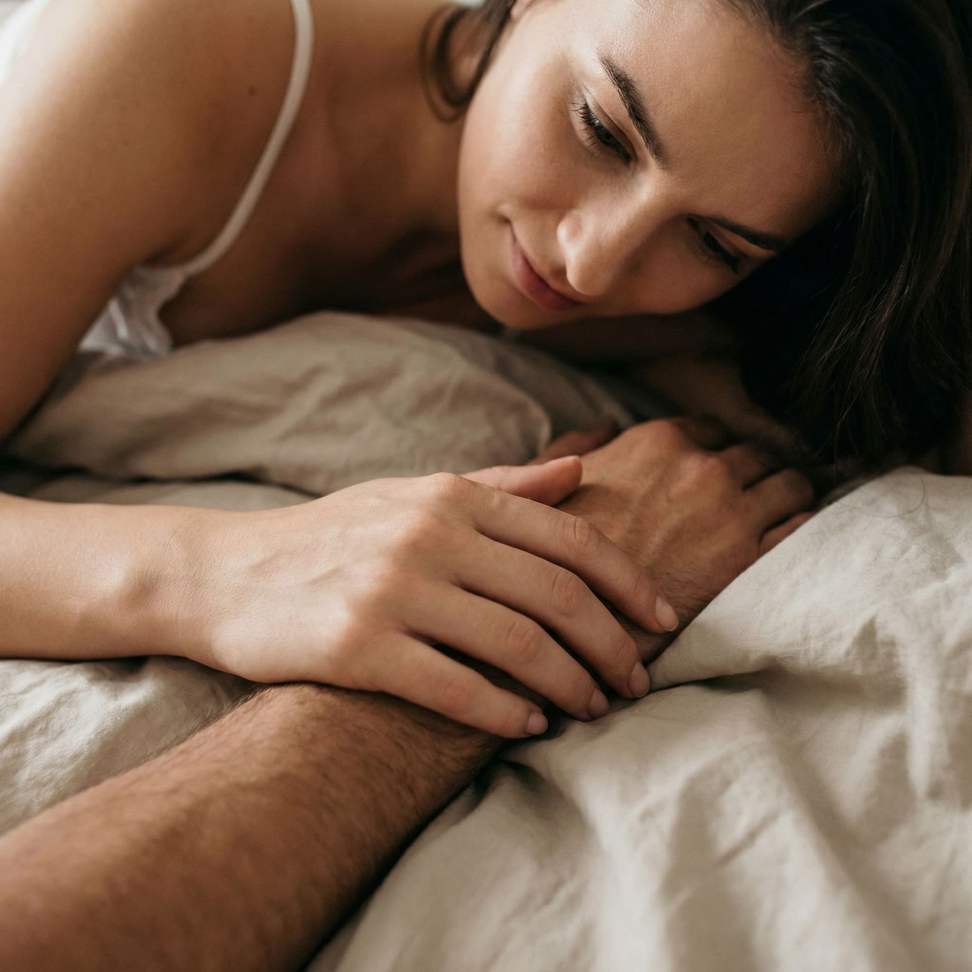 AI generated: she is touching a naked penis and looking sensually at it