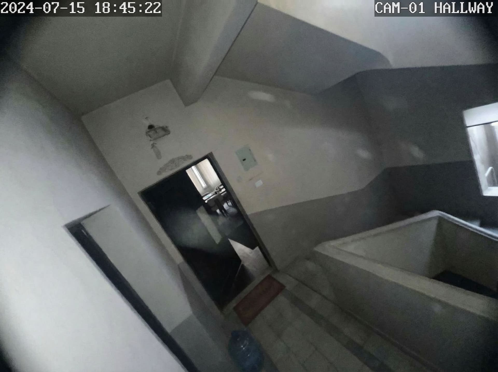 AI generated: Based on the uploaded image, realistic CCTV security camera footage inside a residential building, f...