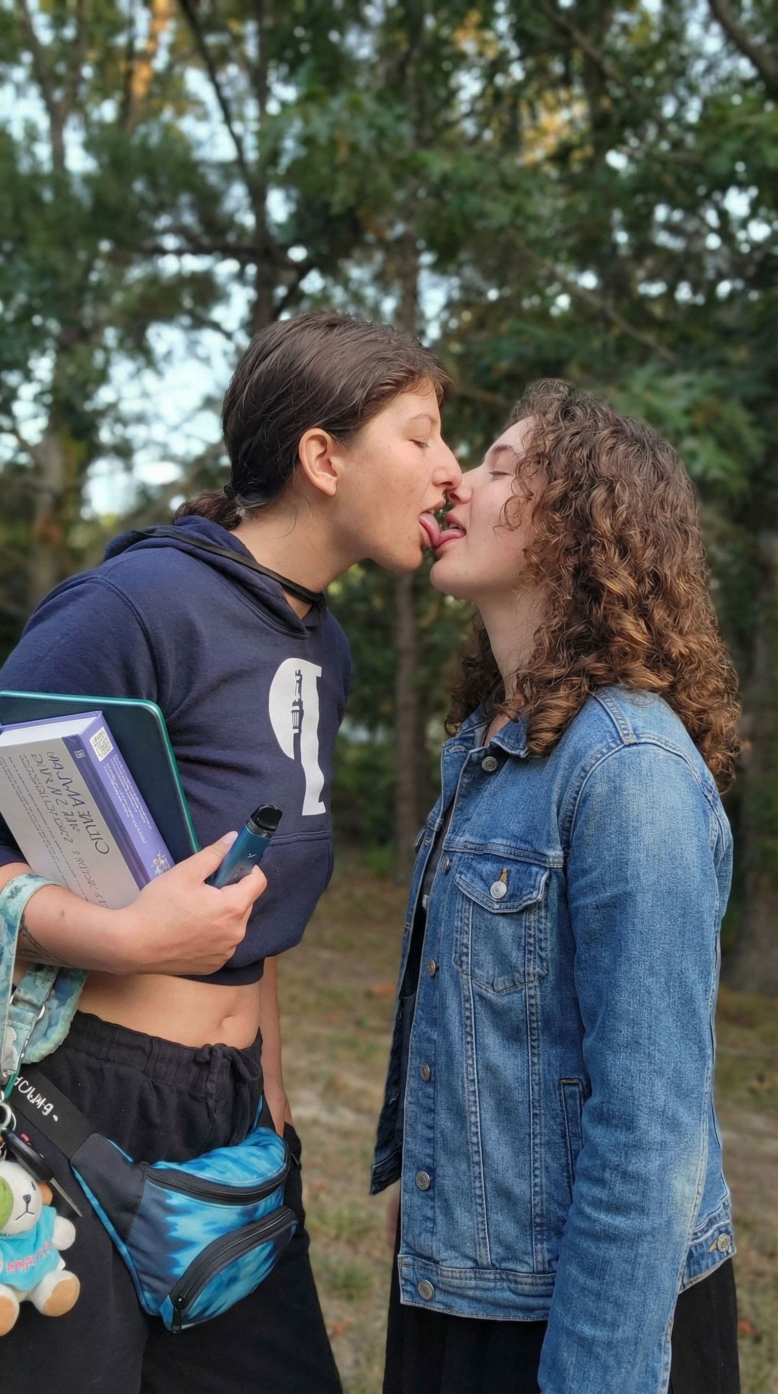 AI generated: two girls passionately kissing with tongue