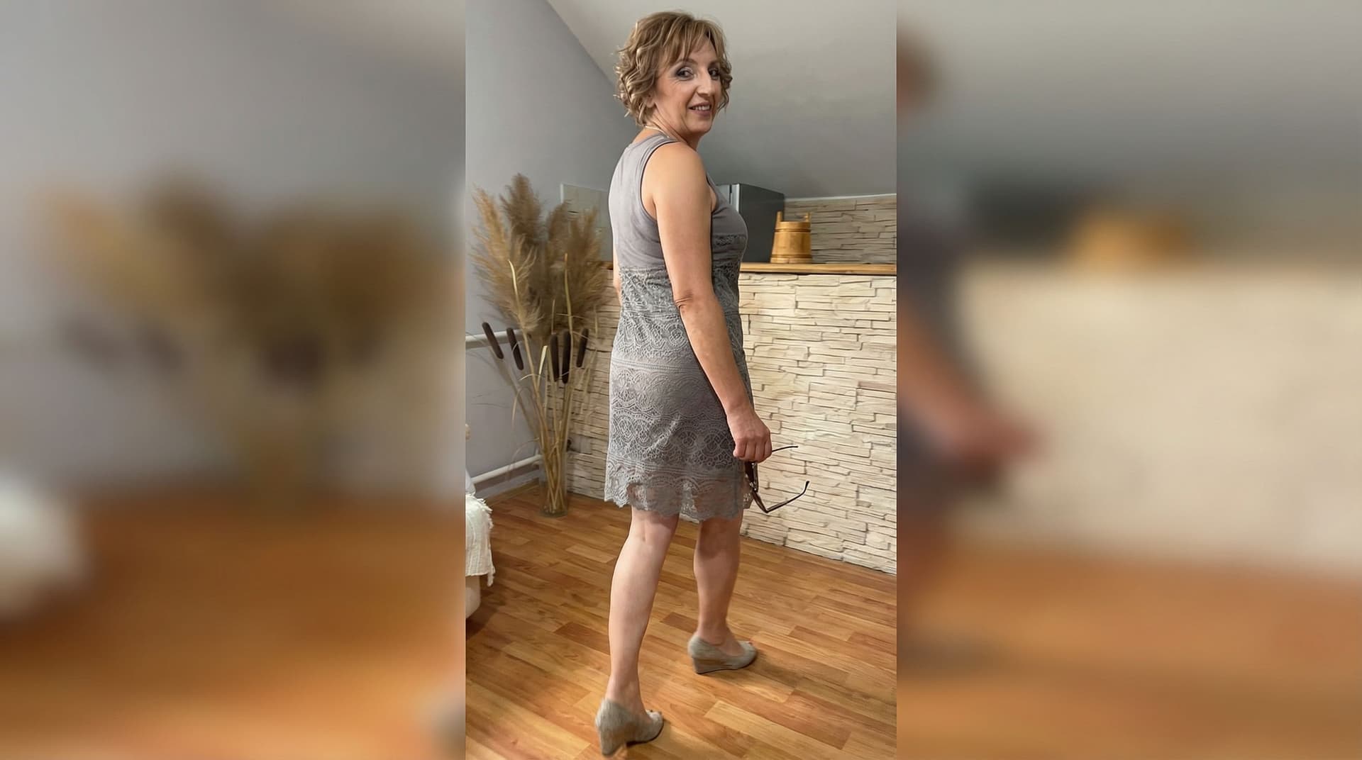 AI generated: 
Have her walking away looking back smiling, camera following her at low angle full body shot