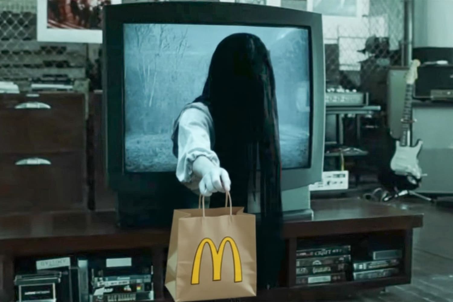 AI generated: DVD Screengrab,The ring horror movie,Samara,extends to the viewer a McDonald's takeaway bag

