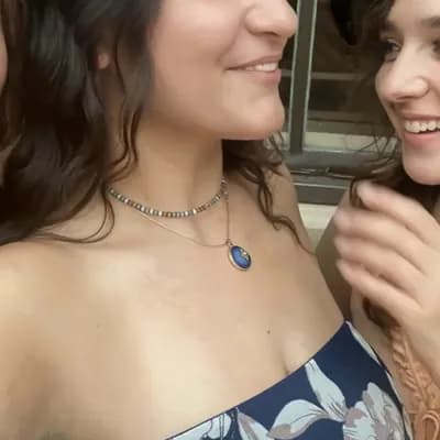 AI generated video: The two girls on the right make out