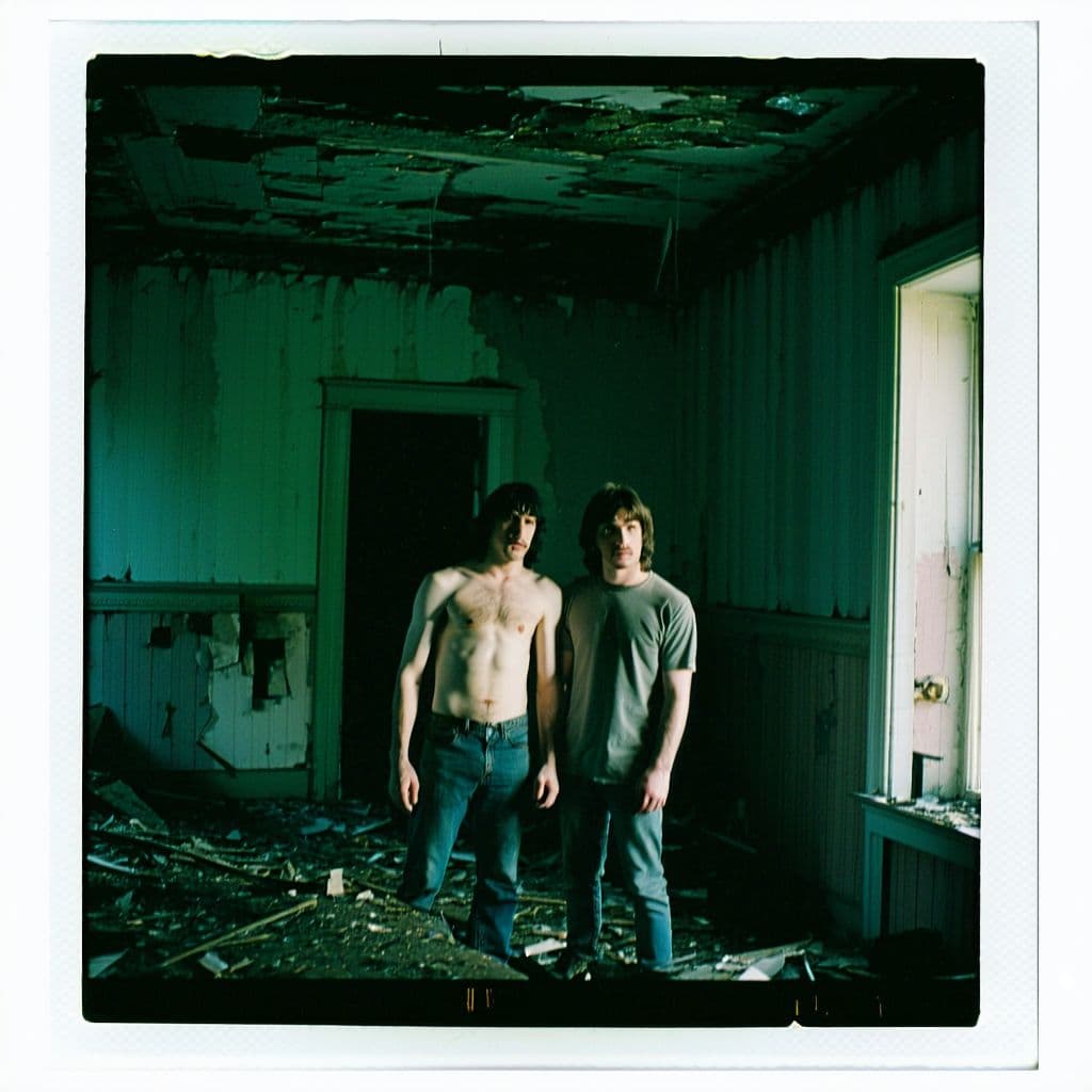 AI generated: grainy 80's photograph quality polaroid of bill and ted suicide caught in an abandoned house, dark