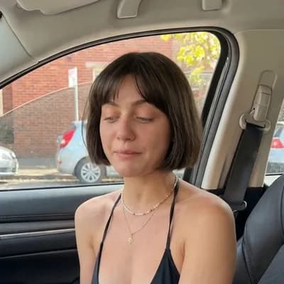 AI generated video: A highly realistic cinematic shot of a young woman, detailed skin texture, no filters. She looks nat...